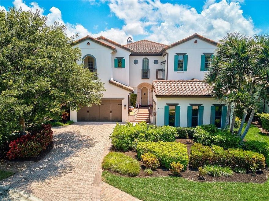 Former Arthur Rutenberg “Terracina” Model.  This multi-award winning home sits on a lakefront homesite in Legends Bay.  Spanish revival-style architecture with a layout that makes the most of the views, both inside and out. Numerous outdoor spaces, including a front courtyard, two story screened lanai, multiple balconies and cabana add to the indoor/outdoor lifestyle found in this special home.  As a former model home, you cannot help but notice that everything in the home has been thoughtfully selected.  Highlights include the chef's gourmet kitchen, with top of the line appliances including a glass front Sub-Zero refrigerator & Wolf dual gas professional range with 5 burner cooktop, griddle and dual ovens. Other features include the 2nd floor bonus room with wet bar, powder room, sunken TV area and access to the 2nd floor balcony with fireplace.  Impact windows, a formal study, heated pool, spa, outdoor kitchen & bath, soaring ceilings, hand-scraped "heritage hickory" flooring, 2 fireplaces (one dual & one on 2nd floor balcony), elevator, wet bar, wine storage, multiple niches and built-ins.  A masterpiece of quality and design. Far too many extras to mention here; feature sheet, floor plan and survey available.  Legends Bay is a private gated community nestled along Sarasota Bay.  Just a short bike ride to world-renowned sport training mega site IMG Academy, as well as IMG Golf & Country Club & Bradenton Tennis Academy.  Less than 7 miles to Anna Maria Island and its gorgeous beaches, fine & casual dining and plenty of shopping. Short drive to downtown Bradenton, Riverwalk, St. Armand's Circle, Sarasota and SRQ International Airport. An ideal location, a highly sought after community, and a dream home makes this the right move!  3 brand new Trane A/C units installed July 2022. Room Feature: Linen Closet In Bath (Primary Bedroom).