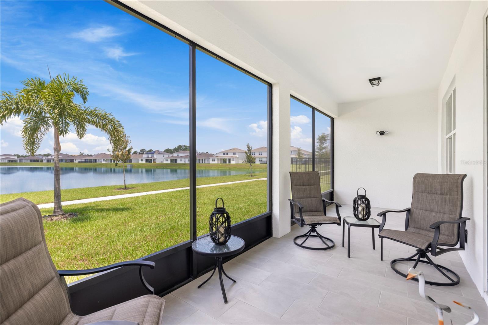 Stunning Lakefront Residence!
Welcome to this pristine waterfront retreat located in the much desired serene Amelia Groves community. Surrounded by lush landscaping and great curb appeal this beautiful four bedroom, three bath home is move in ready, highly upgraded and meticulously maintained. No need to wait for new construction to be built!!
Generous open floorplan features luxury plank flooring, 8' doors, crown moldings, plantation shutters and an abundance of natural light throughout the home.
Culinary enthusiasts will love the custom white kitchen boasting a generous center island with breakfast bar, stainless steel appliances, 42" cabinets with dove tail and soft close doors/drawers, quartz countertops, tile backsplash and a walk-in pantry. Step out to your tropical outdoor space just outside the family room boasting a tiled screened in patio perfect for relaxing, entertaining, dining alfresco and to enjoy the fabulous lake views and sunsets.
Primary suite offers lake views, custom fitted large walk-in closet, linen closet and spa-like primary bath with dual quartz top vanities. Guest en-suite is perfect for family and friends to enjoy. Flex room is a great space for home office, gym/yoga room or bedroom. Upgraded laundry room with custom cabinets, utility closet and plenty of counter space for storage. Two car garage with epoxy flooring, tool storage, an irrigation hub and a wi-fi garage door opener.
Take a stroll on the walking trails around the lake or enjoy the playground and then a dip in pool complete with outdoor shower and changing rooms. Explore local amenities featuring the Lake Lizzie Nature Preserve for hiking, camping, horseback riding and simply enjoying the great outdoors.
Everything needed to enjoy an active lifestyle and live, shop and play is minutes away! PARKS, TRAILS, BOATING & the BEAUTIFUL BEACHES of the East Coast are a short drive including Lake Nona and ORLANDO amenities including professional sports, THEME PARKS & other attractions. If you're up for a day trip take a ride to the pristine beaches of the Gulf of America.
2026 brings a new AAA high school with a super convenient connecting sidewalk to Amelia Grove avoiding the cumbersome car lines.
Low HOA fee includes cable, internet, heated community pool, playground and maintenance of common grounds.
ACTIVE MAINTENANCE CONTRACTS: pest control, termite and lawncare. Eight years remaining on builder’s structural warranty.
This home is a must see! Waterfront homes are in short supply - don’t miss an opportunity to make this fabulous home yours.