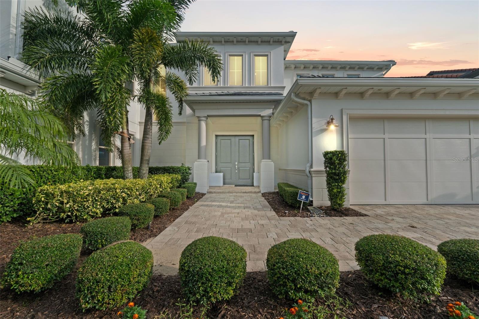 Imagine waking up to the gentle lapping of water, the refreshing breeze off Panther Lake, and the golden Florida sun streaming into your exquisite sanctuary. This isn't just a dream; it's the reality awaiting you at this extraordinary 6,400+ square foot lakefront estate, nestled within the highly coveted Lakeshore Preserve community in Horizon West, Winter Garden. From the moment you step inside, you'll be captivated by soaring ceilings and immediate, unobstructed views of Panther Lake that stretch beyond the expansive living spaces. This isn't merely a home; it's a masterpiece of design, boasting 7 bedrooms, 6.5 bathrooms, a dedicated office, a state-of-the-art theatre, a convenient butler's pantry, and an oversized laundry room, all meticulously crafted with unparalleled finishes, luxurious tile, and hardwood floors throughout. Every detail, from custom shelving and accent walls to a gourmet kitchen with an oversized quartz island and wine fridge, Whether you're a gourmet chef or simply love to cook, this luxurious gas stovetop elevates every meal. has been thoughtfully curated for the most discerning taste. The immense primary suite offers a private haven with breathtaking lake views, a spa-like bathroom, and an immense custom walk-in closet. Upstairs, five generous bedrooms, three with ensuites, and an open loft leading to a screened balcony overlooking the serene lake provide ample space and privacy. Beyond your private oasis, indulge in the resort-style amenities of Lakeshore Preserve, including a zero-entry pool, clubhouse, fitness center, kayak launch, and miles of walking trails. With A-rated schools, top-rated private academies, and every essential convenience just minutes away, including The Mark Plaza, extensive shopping, dining, and Horizon West Hospital, and a mere 10-minute drive to Disney World with easy access to major highways, this is more than just a home—it's an unparalleled lifestyle. Don't just imagine your dream life, live it. Call today to schedule your private visit.