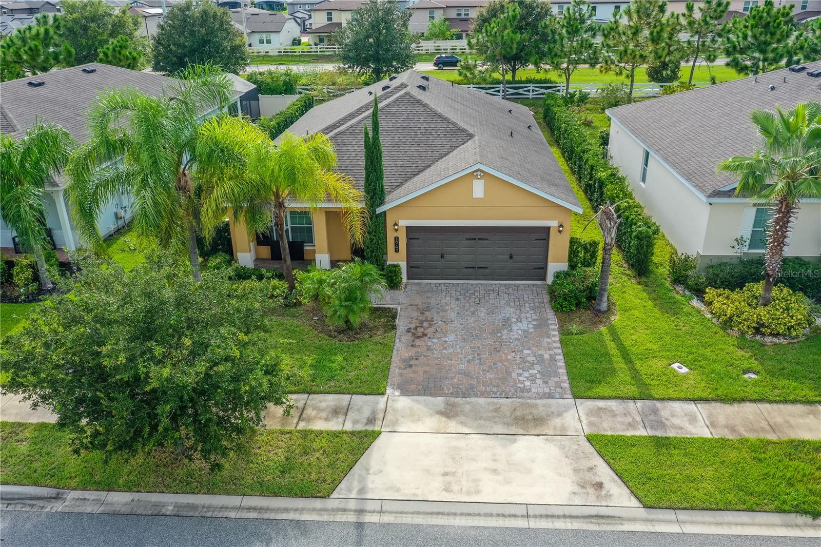 MOTIVATED SELLER! Don’t miss this beautifully maintained 4-bedroom, 2-bathroom home located in the desirable Hanover Reserve community. This spacious and cozy single-story residence offers an open-concept floor plan, stylish tile flooring, and a large upgraded kitchen with plenty of counter space and storage—perfect for both everyday living and entertaining. Step outside and enjoy your private backyard retreat featuring pavers, a fire pit for cozy evenings—perfect for relaxing or hosting family and friends. Hanover Reserve is a family-friendly neighborhood that offers a playground and a welcoming community feel. Its location is unbeatable—just south of Lake Nona and close to shopping, dining, top-rated schools, and Medical City. You’ll also have easy access to Valencia College, Orlando International Airport, SR 417, and the Beachline (528), making commuting and travel simple and convenient. This home is a rare combination of comfort, value, and location, offering upgrades and luxury finishes that make it unique in the area. Schedule your showing today and discover why this is the perfect place to call home!