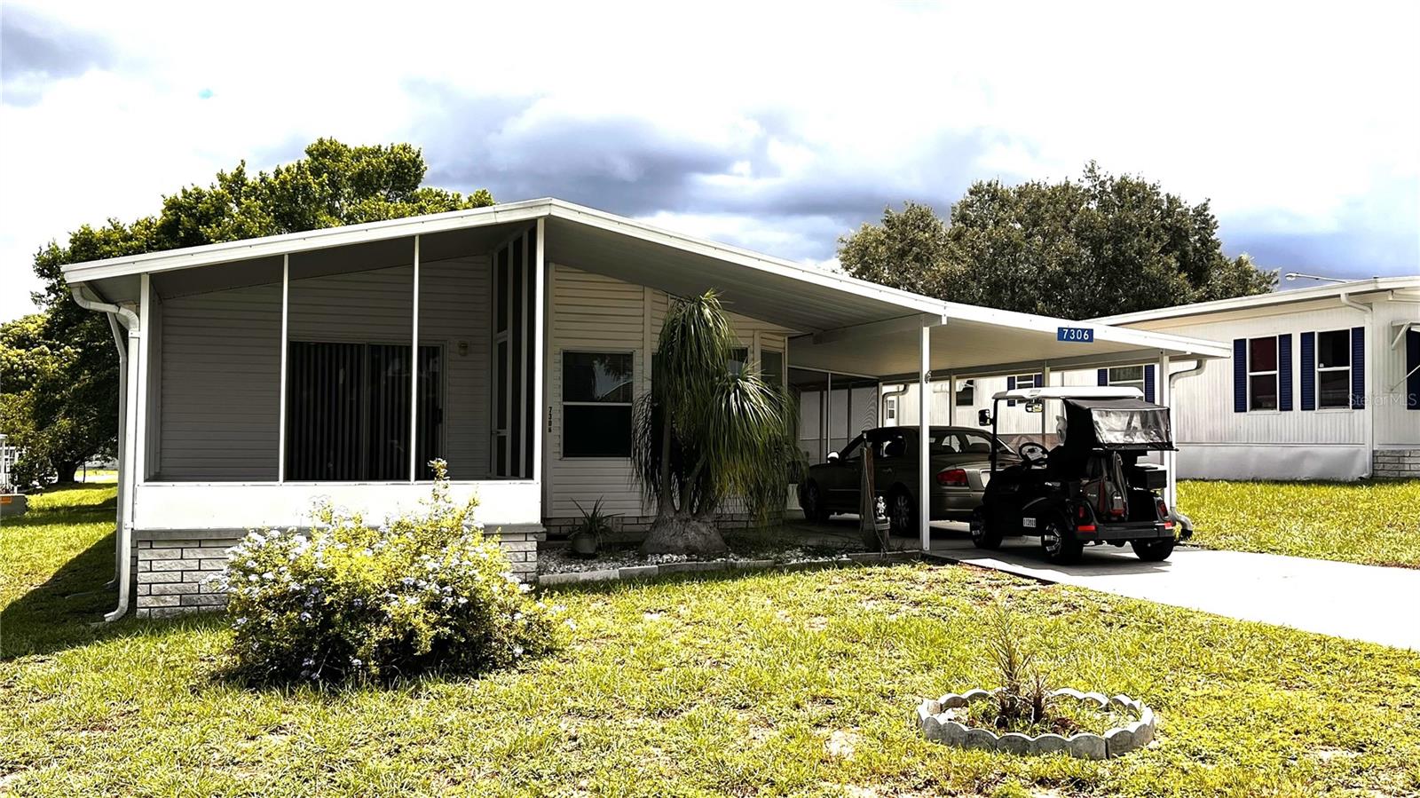 Call 7306 Score Street your new address here in Florida in the High Point Community. Great 55+ golf community with low HOA fees to allow you to enjoy the best of Florida. This 2 bedroom 2 bath home has been well maintained and is move in ready. Beautiful kitchen with just enough natural light from the Florida sun to make you feel right at home. Imagine sitting on the front screened in porch enjoying a delicious meal and your favorite drink. Newer A/C, refrigerator, dishwasher and washing machine. There is a storage area for your lawn and gardening tools. It also has a fenced in rear area of the yard for your fur babies to roam freely and safely. Nice covered carport and long driveway for your golf cart or other toys. HOA dues are approximately $45 monthly. The High Point 55+ community offers so many amenities to enjoy including a heated pool, shuffleboard, tennis, golf and the famous sport of pickleball. It is also centrally located close to major highways, restaurants, entertainment, shopping and hospitals.