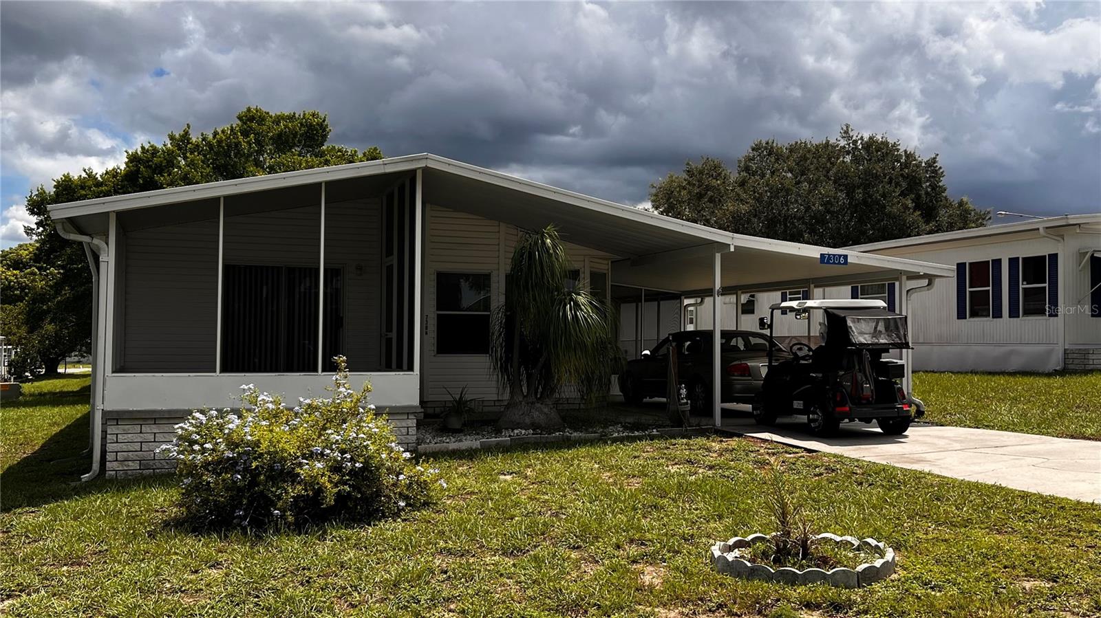 Call 7306 Score Street your new address here in Florida in the High Point Community. Great 55+ golf community with low HOA fees to allow you to enjoy the best of Florida. This 2 bedroom 2 bath home has been well maintained and is move in ready. Beautiful kitchen with just enough natural light from the Florida sun to make you feel right at home. Imagine sitting on the front screened in porch enjoying a delicious meal and your favorite drink. Newer A/C, refrigerator, dishwasher and washing machine. There is a storage area for your lawn and gardening tools. It also has a fenced in rear area of the yard for your fur babies to roam freely and safely. Nice covered carport and long driveway for your golf cart or other toys. HOA dues are approximately $45 monthly. The High Point 55+ community offers so many amenities to enjoy including a heated pool, shuffleboard, tennis, golf and the famous sport of pickleball. It is also centrally located close to major highways, restaurants, entertainment, shopping and hospitals.