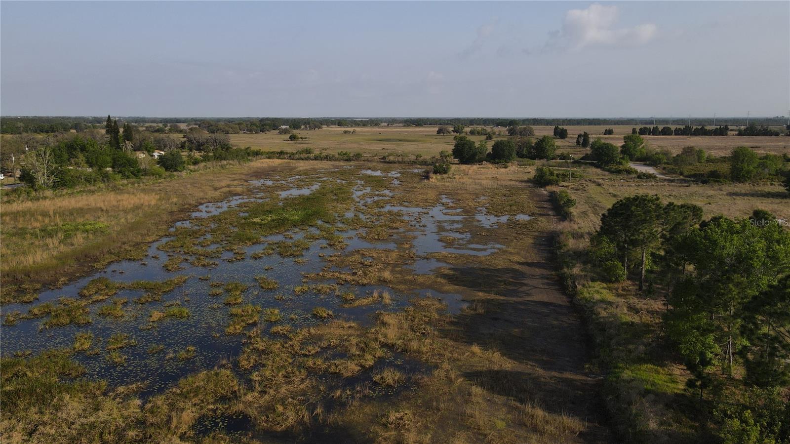 ALMOST THIS WHOLE PROPERTY IS WATER, ALMOST DEFINITELY NOT BUILDABLE
This property offers access from both Primrose Ln and Fruitville Ave, but is entirely within a flood zone and not suitable for building. Free from HOA and deed restrictions. Perfect for outdoor and recreational activities!
Just 25 minutes from Lake Wales, offering amenities like Pine Ridge Trail, Jump Florida Skydiving, Bok Tower Gardens, and Window by the Pond. 35 minutes from LEGOLAND Resort. Enjoy plenty of nearby recreational activities and the charm of several large cities with numerous lakes!
Go and Show!