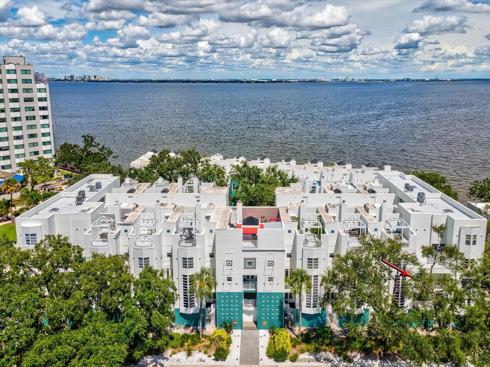 Welcome to this beautifully updated 2-bedroom, 2.5-bath townhome-style condo located in a gated and community along Tampa’s iconic Bayshore Boulevard. Just one block South of the Bayshore Blvd waterside sidewalk which is one of the longest continuous sidewalks in the U.S…This corner unit offers 1,296 sq ft of stylish living space, thoughtfully designed with modern upgrades and timeless charm. All new Impact Rated WINDOWS and DOORS with new shades. Step inside to find gleaming wood look tiles on first floor and matching LVP on the 2nd floor., an open concept living and dining area, and a gourmet kitchen featuring shaker cabinets, quartz countertops, new stainless steel appliances, and a built-in wine fridge. Also, you will find a remodeled half bath on first floor. Upstairs, both bedrooms feature remodeled ensuite bathrooms and custom closet systems—perfect for comfortable, private living. Another great feature on both floors, in the master bedroom and living room, is a private outdoor porch. Enjoy the convenience of covered, direct-access and secured parking, and a private storage closet. This gated community is just steps from Ballast Point Park, the Bayshore Greenway Trail, and some of South Tampa’s best shopping, dining, and schools. Condo dues cover escrow reserves fund, insurance, maintenance exterior, maintenance grounds, pest control, water, sewer, cable TV and trash. Just minutes from MacDill AFB, downtown Tampa, Hyde Park, River Walk, Tampa General Hospital, and Memorial Hospital. Don’t miss your chance to own a turnkey property in one of Tampa’s most desirable neighborhoods.