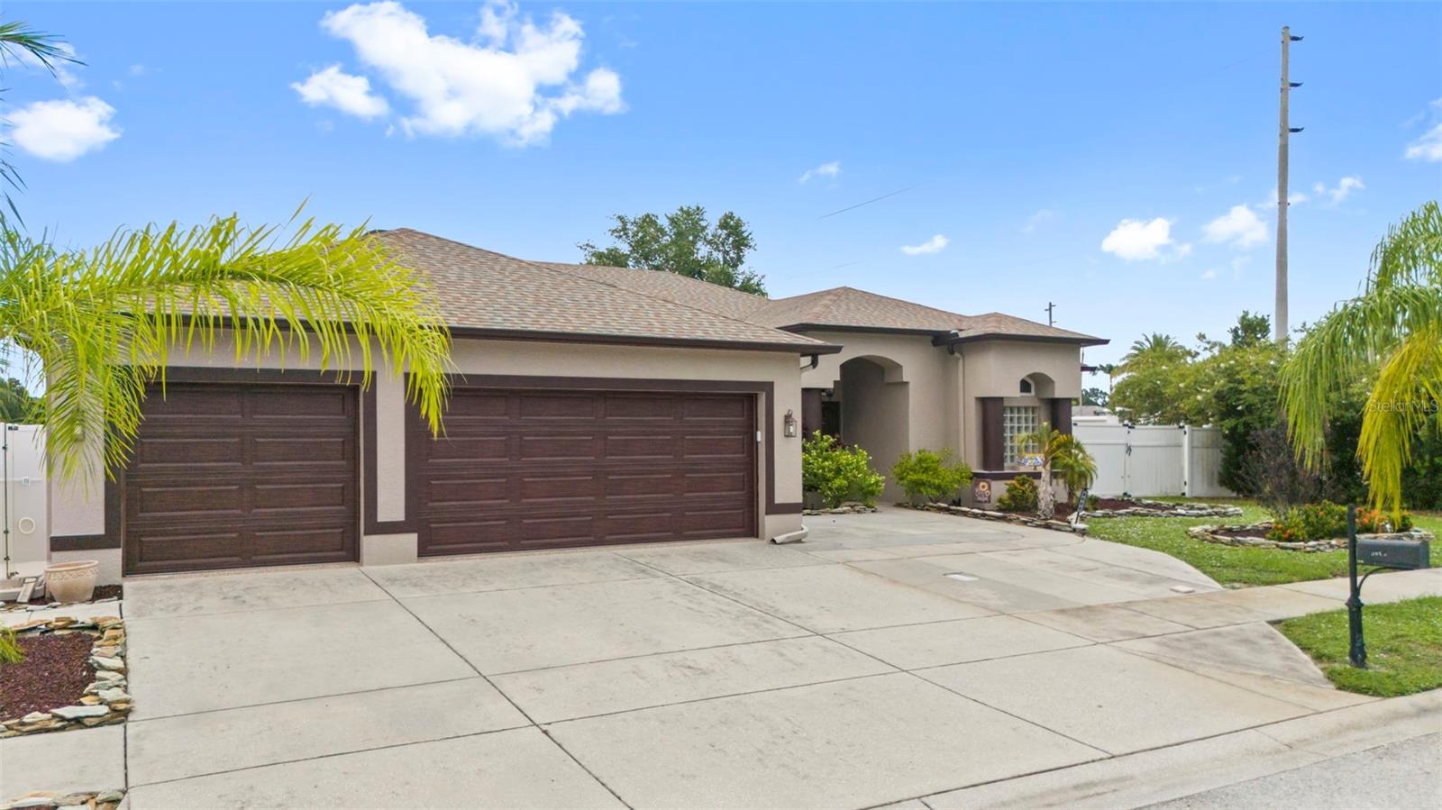 UPDATES EVERYWHERE. DO NOT MISS THIS OPPORTUNITY! GORGEOUS 4 BEDROOM, plus SITTING ROOM.DEN, 2 BATHROOM, 3 CAR GARAGE, POOL HOME with a VERY LONG LIST OF UPGRADES. NEWER ROOF (3 years old), UPDATED A/C, IMPACT WIDOWS, TEXTURED CEILINGS, LUXURY TILE and VINYL FLOORING EVERYWHERE, IMPACT GARAGE DOOR, IMPACT FRONT DOORS, FULL WALL ENTERTAINMENT CENTER, GRANITE KITCHEN with HIGH-QUALITY STAINLESS-STEEL APPLIANCES, INTERIOR LAUNDRY ROOM, STUNNING IN-GROUND POOL with AMBIENT LIGHTING and SCREEN ENCLOSURE, OUTDOOR FIRE-PIT with LONG AND BEAUTIFUL VIEWS overlooking a SERENE LAKE, OVERSIZED 3-CAR GARAGE with EPOXY FLOOR FINISH, HIGH CEILINGS, CEILING FANS in almost EVERY ROOM. Close to restaurants, shopping, hospitals and just a short commute to Tampa International Airport and the Bay area Beaches. This home is in TRUE MOVE-IN CONDITION. Do not miss this one!!
