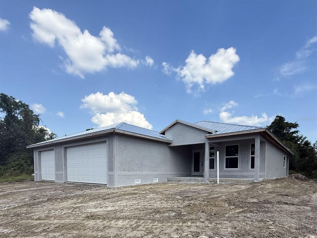 Photo of 9340 Canna Street, Port Charlotte, FL 33981 (MLS # C7514455)