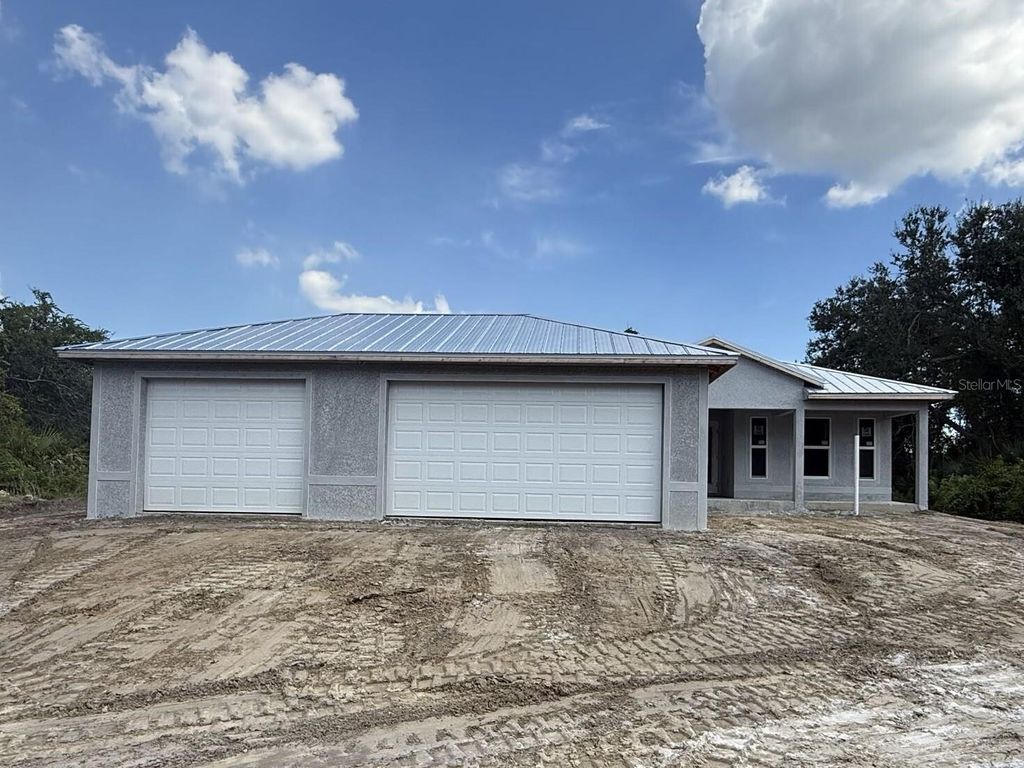 Photo of 9340 Canna Street, Port Charlotte, FL 33981 (MLS # C7514455)