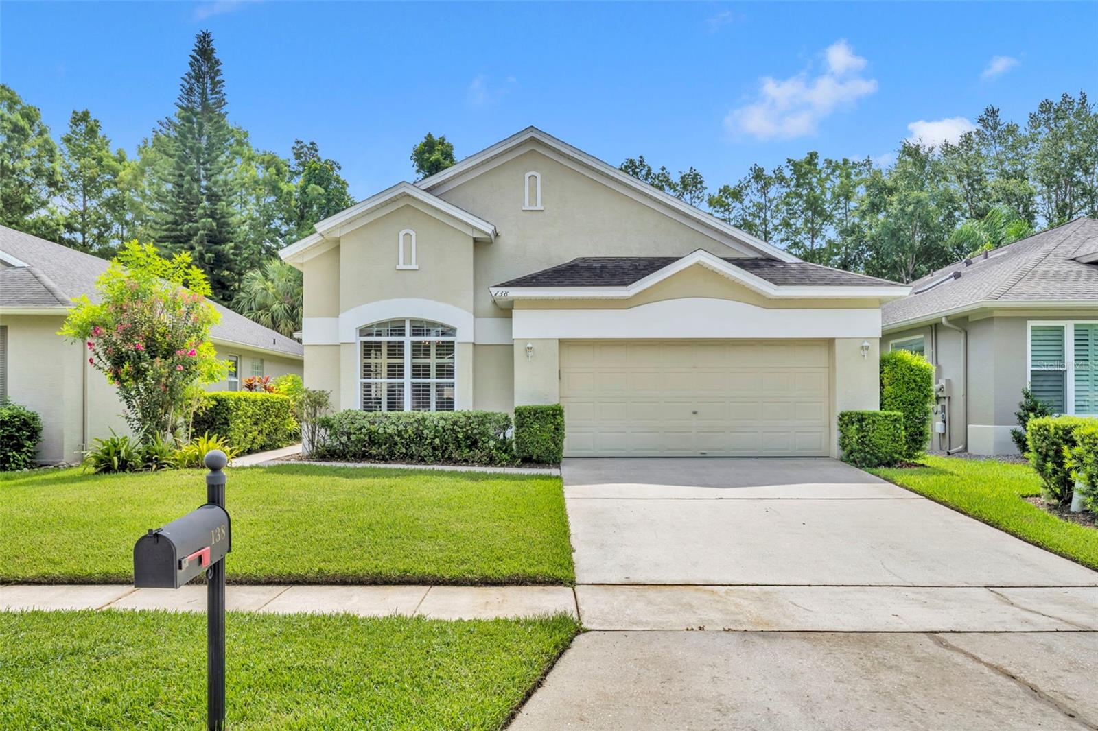 One or more photo(s) has been virtually staged. Welcome to this beautifully maintained 3-bedroom, 2-bathroom home located in the sought-after gated community of Eagles Watch in Winter Springs. The path to easy, carefree living begins as you walk through the garden-like walkway to the front door inviting you inside to enjoy an abundant light filled family room with vaulted ceilings and large sliding glass door to your spacious screened-in lanai allowing you to enjoy the sounds of nature as you sip your morning coffee. Comfort continues as this home offers a desirable split floor plan and features updated flooring throughout, plantation shutters, large kitchen with built-in buffet for additional storage along with kitchen counter bar seating, solid wood cabinetry and additional space off the kitchen for a large dining table or living room for more comfort and flexibility. The primary suite is a true retreat, accessible through elegant double doors and boasting a massive walk-in closet. Bring your king size bed because this bedroom has plenty of space for all your bedroom furniture! The en-suite bathroom has classic design features with granite countertops, dual sink vanity, garden tub, and separate shower. Two additional bedrooms are thoughtfully situated on the opposite side of the home and share a well-appointed full bathroom, offering both comfort and privacy for guests or family members to enjoy. The convenience of a two-car garage and low-maintenance living with HOA-covered lawn care for the front and side yard is just another reason to throw away that lawn mower! Kick back and utilize the community amenities including a sparkling pool and a playground, ideal for that laid back, low maintenace lifestyle you deserve. Located close to top-rated schools, shopping, and dining, this home offers the perfect blend of comfort, style, and convenience. Enjoy golf? You're in luck! Tuscawilla Golf Course is just a golf cart drive away and ready for you to show off your golf swing! Don't miss this exceptional opportunity to own in one of Winter Springs’ premier communities.  Convenient to the 417 and the Cross Seminole Trail.... what more could you ask for?