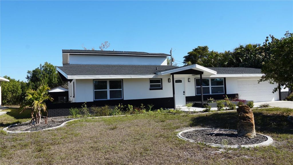 Photo of 177 Dowling Avenue NE, Port Charlotte, FL 33952 (MLS # O6385323)