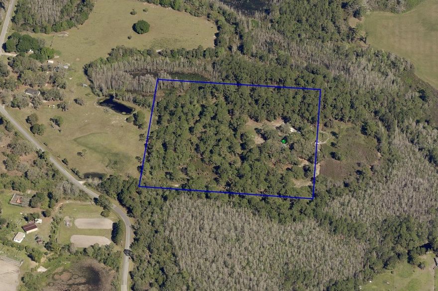 Over 8+ Acres of High and Dry Useable land! Tucked away in Clermont’s Groveland Farms area, 9121 Florida Boys Ranch Road delivers the acreage and freedom you’ve been hunting for—approximately 10.00 acres total, with no HOA, room for horses, and multiple options for a custom home-site. A prior homesite sits on the property (value primarily in the land), giving you a head start on planning and a potential impact-fee savings opportunity. With long road frontage for an easy pull-through drive and a cleared area ready for siting, the land unfolds as open pasture punctuated by mature oaks and natural Florida vegetation—private, quiet, and less than 15 minutes to downtown Clermont conveniences and SR-50/Florida’s Turnpike. Based on available county/ agency mapping, the tract appears to offer a substantial upland/pasture component with pockets of lowland/wetlands, providing both buildable space and a natural buffer. Bring your vision—barndominium, estate home, hobby farm, or a simple country retreat—and make this versatile parcel your own. Buyer to verify specific build-envelope, utilities, and any agricultural/residential use requirements with Lake County.