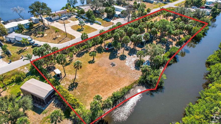 Welcome to 2619 River Bend Drive in Ruskin, Florida, an exceptional opportunity to own 1.7 acres of waterfront land with direct canal access to Hayes Bayou, connecting to the Little Manatee River. This vacant residential lot offers the perfect blend of privacy, space, and water access—ideal for building your dream home or securing a high-potential investment property. This spacious waterfront lot includes a large metal storage shed with a screened-in enclosure, providing valuable space for storage, equipment, or outdoor entertaining while you plan your build. Paved road access makes the property easy to reach, and the Wildcat Park Boat Ramp, located just ½ mile away, offers quick and convenient access for boating, kayaking, and fishing. Enjoy the peaceful setting of a canal-front property while remaining close to major waterways, nature, and outdoor recreation. Whether you envision a custom home, weekend retreat, or long-term investment, this Ruskin waterfront land for sale offers endless possibilities. Property Highlights:1.7 acres of waterfront land in Ruskin, FL Canal access to Hayes Bayou and Little Manatee River Large metal storage shed with screened enclosure Paved road access Near Wildcat Park Boat Ramp (approx. ½ mile) Ideal for boating, fishing, and waterfront living Property is being sold As-Is. Buyers to verify utilities, zoning, building requirements, and any restrictions. Don’t miss this rare chance to own waterfront land in Ruskin, Florida—a prime location with space, water access, and incredible potential.