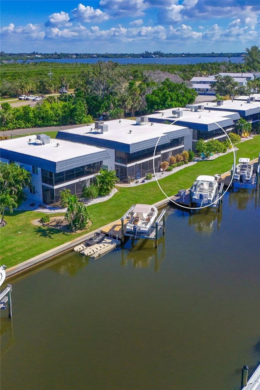Location is paramount when it comes to Florida outdoor living. This exceptional waterfront two-story condominium, with 1,728 sq. ft. under air, 2 bedrooms, 3 baths, 2 bonus rooms, family, dining and living rooms, inside laundry closet and a 2-car oversized garage, features a dock in your backyard equipped with water, electricity and a 10,000-pound capacity boat lift. The property offers direct access to Palma Sola Bay, the Intercoastal Waterway, Egmont Key, and Gulf—all minutes away—with no fixed bridges impeding navigation. Surrounded by saltwater canals, the area provides excellent opportunities for kayaking and canoeing. Nature enthusiasts will appreciate the proximity to Neal Preserve and the sandy white beaches of Anna Maria Island (AMI), located just three miles from the property.
The residence emphasizes maintenance-free living, presenting numerous options to enjoy the surroundings both day and night. Manatees and dolphins are frequently observed in the saltwater canal directly in front of the screened-in porches, while the sunsets create a stunning backdrop. Upon entry, shiny bamboo flooring leads you down the hallway. The well-appointed chef’s kitchen includes stainless steel appliances, an induction stove and air fryer, solid wood cabinetry, under-cabinet lighting, and expansive granite countertops. The guest bedroom and updated guest bathroom are situated to the left, with the primary bedroom offering canal views. The living and dining rooms are located straight ahead, with easy access to the downstairs area via the adjacent staircase. Impact sliding doors lead out to screened-in porches on both levels. The first-floor features durable tile flooring, storage under the stair well, Endura flood waterproof drywall, a comfortable family room, a full bathroom, and two versatile bonus rooms currently utilized as guest bedrooms. Community amenities include an oversized heated pool, tennis/pickleball court, and a basketball court. In addition, shopping, restaurants, entertainment venues, downtown Bradenton, Sarasota, Longboat Key, St. Armands, UTC Mall, and Sarasota/Bradenton Airport are all conveniently nearby. Possible temporary 1-0 buydown rate covered by lender. Call for details. Don’t let this unique property get away. Schedule your private showing soon!