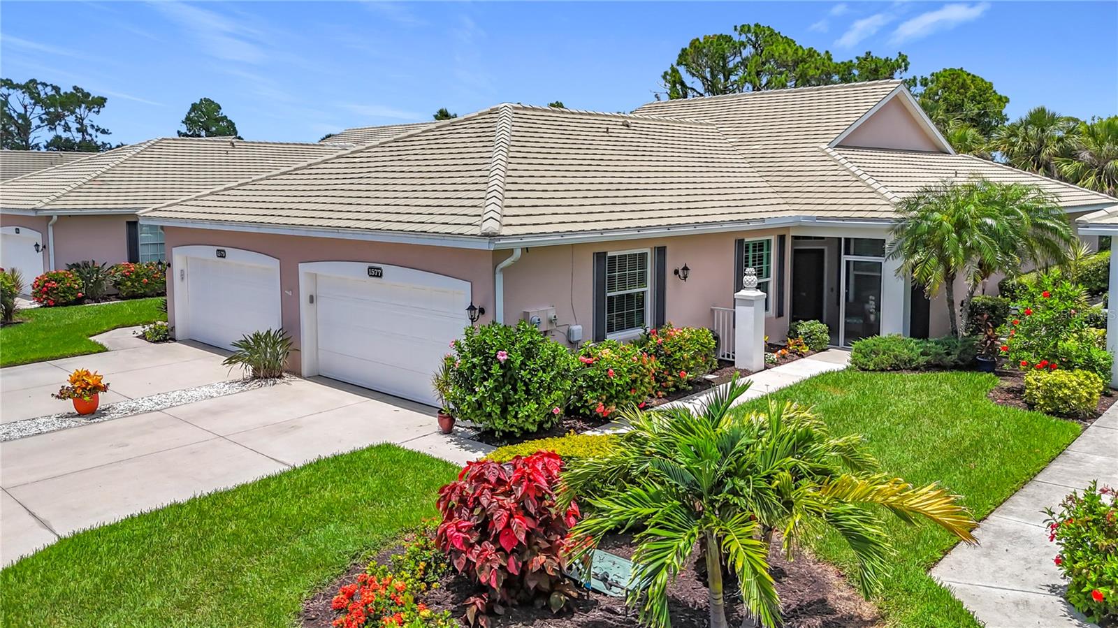 mmaculately Maintained Villa in the acclaimed Plantation Golf & Country Club. REDUCED $40000!! FOR QUICK SALE - BRING OFFERS, SELLER IS HIGHLY MOTIVATED!! Back on market, not due to inspection. This home is immaculate. Almost Turnkey! Many furnishings can stay. Annual Rental Available for $2500 a month. This meticulously cared-for paired villa offers a maintenance-free lifestyle in one of the most sought-after communities in Venice. The HOA covers all exterior maintenance, including roof care, painting, and lawn care, ensuring a worry-free living experience. The home itself boasts a serene, private, and lush tropical backyard, complemented by a spacious lanai-perfect for relaxing or entertaining. With over 1,700 square feet of living space, the home offers plenty of room to spread out and enjoy the Florida lifestyle. The floor plan includes two generously sized bedrooms plus a versatile den/office space, ideal for work or leisure. Very easy to convert into a 3 bedroom with the addition of a closet. The attached two-car garage with epoxy-finished floors adds extra convenience and durability. Every detail has been thoughtfully updated, including a newer refrigerator, microwave, deep stainless steel sink, and contemporary light fixtures and ceiling fans. The home is freshly painted, with tile and luxury vinyl flooring throughout, adding both style and ease of maintenance. The front three windows are impact-resistant for added peace of mind. The spacious primary bedroom features dual walk-in closets and an en-suite bath with a walk-in shower and dual sinks, creating a spa-like retreat. There are two community pools in the neighborhood for you to enjoy. Optional club membership is available to the renowned Plantation Golf & Country Club, where residents can enjoy world-class amenities including two 18-hole championship golf courses, 13 Har-Tru tennis courts, six pickleball courts, Bocce ball, a fitness center, and a Jr. Olympic pool. Exceptional dining options and a variety of social programs are available. Just minutes from Venice's stunning beaches, historic downtown, charming cafés, boutique shopping, and renowned restaurants,