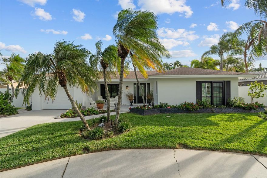Welcome to your coastal retreat! Just minutes from the sand and surf, this stunning 2-bedroom, 2-bathroom pool home offers the perfect blend of modern updates and relaxed coastal charm.  Step inside to discover an open and airy floor plan filled with natural light. The updated kitchen features sleek countertops, stainless steel appliances, and ample cabinet space—ideal for entertaining or quiet nights in. Both bathrooms have been tastefully remodeled with high-end finishes, offering a spa-like experience in your own home. The spacious primary suite boasts a walk-in closet and direct access to the outdoor oasis. Step outside to your private backyard paradise with a pool, lush landscaping, outdoor shower and a large, enclosed patio. Whether you are hosting weekend barbecues, enjoying sunset cocktails or simply unwinding under the stars, this outdoor space is designed for year-round enjoyment. Other highlights include newer HVAC including duct work and insulation, plumbing and electric all updated in 2023, hurricane impact windows and doors, indoor laundry, tankless hot water heater, new flooring throughout, outdoor lighting and irrigation system and so much more. Whether you're looking for a full-time residence, a vacation home, or an investment property, this coastal gem is the perfect blend of relaxed living and seaside charm. Don't miss this rare opportunity to own a updated, move-in ready home just moments from the coast, amazing dining, and all that Florida living has to offer. Call today for your showing. Paradise awaits!!!