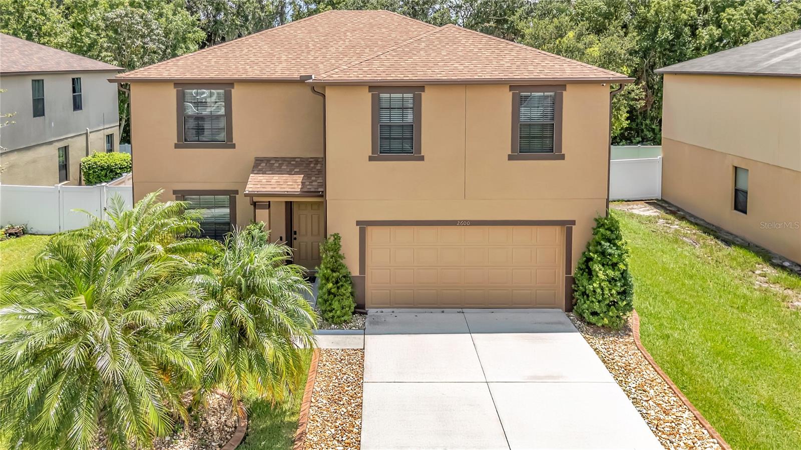 This pool home at 2600 Vineyard Cir in Sanford is a one-owner property that has been meticulously maintained and thoughtfully updated throughout. Featuring 4 bedrooms, 2.5 bathrooms, and a private backyard oasis, this home combines modern upgrades, functional living spaces, and resort-style outdoor living.
The updated kitchen offers an island, brown backsplash, stylish cabinetry, recessed lighting, and a 6-year-old convection oven and dishwasher. Recent improvements include a new roof installed in 2022, fresh exterior paint completed in 2024, and an updated staircase that enhances the home’s interior flow. The extra-long driveway provides plenty of parking for guests or multiple vehicles.
The fully-fenced backyard is a true retreat, backing up to a peaceful conservation area for added privacy. Enjoy the fully-operational saltwater pool added in 2014, reaching eight feet deep; a screen enclosure replaced in 2024 and a fully-operational pool heater allow for year-round enjoyment. Beautiful river rock landscaping completes the upgraded outdoor space.
Practical updates include a 6-year-old AC system and a 2-year-old water heater, offering peace of mind. Built-in surround sound with in-wall wiring adds entertainment value throughout the home.
This home is conveniently located near Publix at King’s Crossing, Midway Park, schools, and commuter routes, blending suburban comfort with urban conveniences.
Don’t miss this opportunity to own a beautifully updated pool home with privacy and style in one of Sanford’s most sought-after neighborhoods.