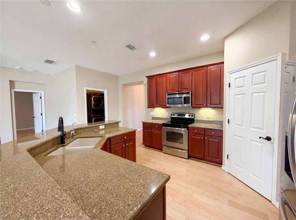 Photo of 5605 Windsong Oak Drive, Leesburg, FL 34748 (MLS # O6418852)