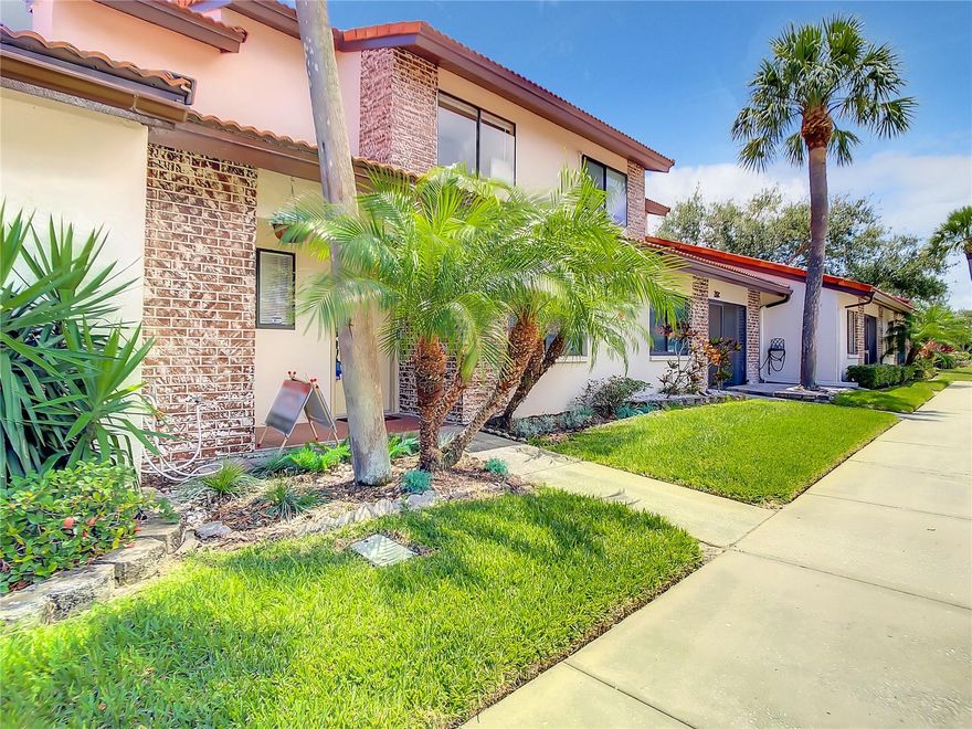 Owner is ready to sale. Bring all written offers. Seller can assit with closing cost etc. 
Bring your pets.  Association has no weight limit on dogs.  Community pool is heated. Enjoy charming 3 bed 2 bath WITH additional heated and cooled space can be easily used as a FOURTH bedroom. Very unique living experience for a condo. Property has a front porch another area which is closed in and a covered patio which has a live, natural canopy covered lanai and hot tub electric hook up in place. Kitchen is inviting with room for family and friends.  Kitchen is separated by a partition wall ideal for tv and digital equipment. Two bedrooms are located upstairs with a bathroom and 3rd bedroom is on the 1st floor with another full bath. Living/family room is spacious and has room for larger couches. There is also Air conditioned glass enclosed Florida room with storage easily use a fourth bedroom. Bring your furniture and make this home.