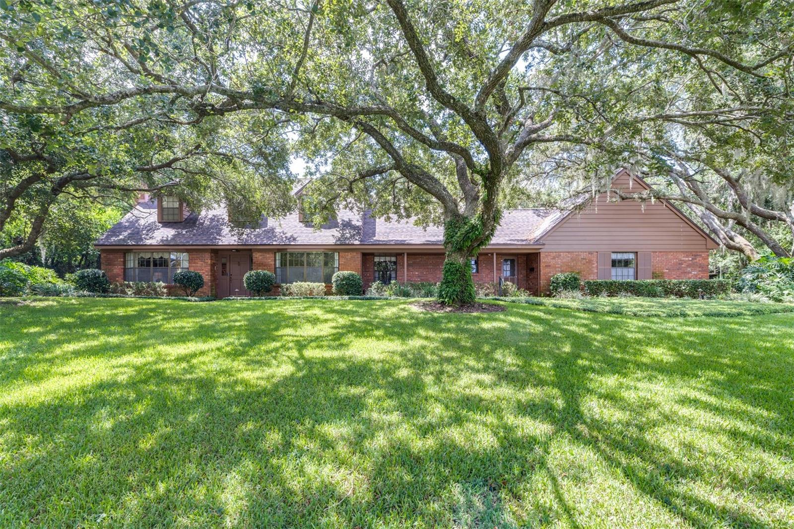 Welcome to this beautiful custom-built home nestled in the heart of Lake Wales. Built in 1969 and thoughtfully maintained, this spacious 4-bedroom, 3-bathroom residence offers 2,796 square feet of living space on just over an acre of land, combining timeless character with modern updates. Step inside to find a warm and inviting layout perfect for both family life and entertaining. The large living room and cozy family room—complete with a wood-burning fireplace—provide plenty of space to gather. A generous screened-in back porch invites you to enjoy peaceful mornings or relaxed evenings while overlooking your private backyard oasis. Professionals will appreciate the dedicated home office, offering a quiet, light-filled space to work from home. The two-car garage includes built-in storage, while additional storage options include a backyard shed and a large attic space. The home’s mature landscaping, inspired by the serenity of Bok Tower Gardens, creates a lush, tranquil atmosphere all around the property. Energy efficiency is already in place with a 2-year-old roof and solar panels, helping keep utility costs low year-round. Ideally located near downtown Lake Wales, Lake Wailes Lake, shopping, schools, and the hospital, this home provides both convenience and comfort. With space, charm, and thoughtful upgrades, this home is a rare find in one of Central Florida’s most beloved communities. Schedule a private showing today!