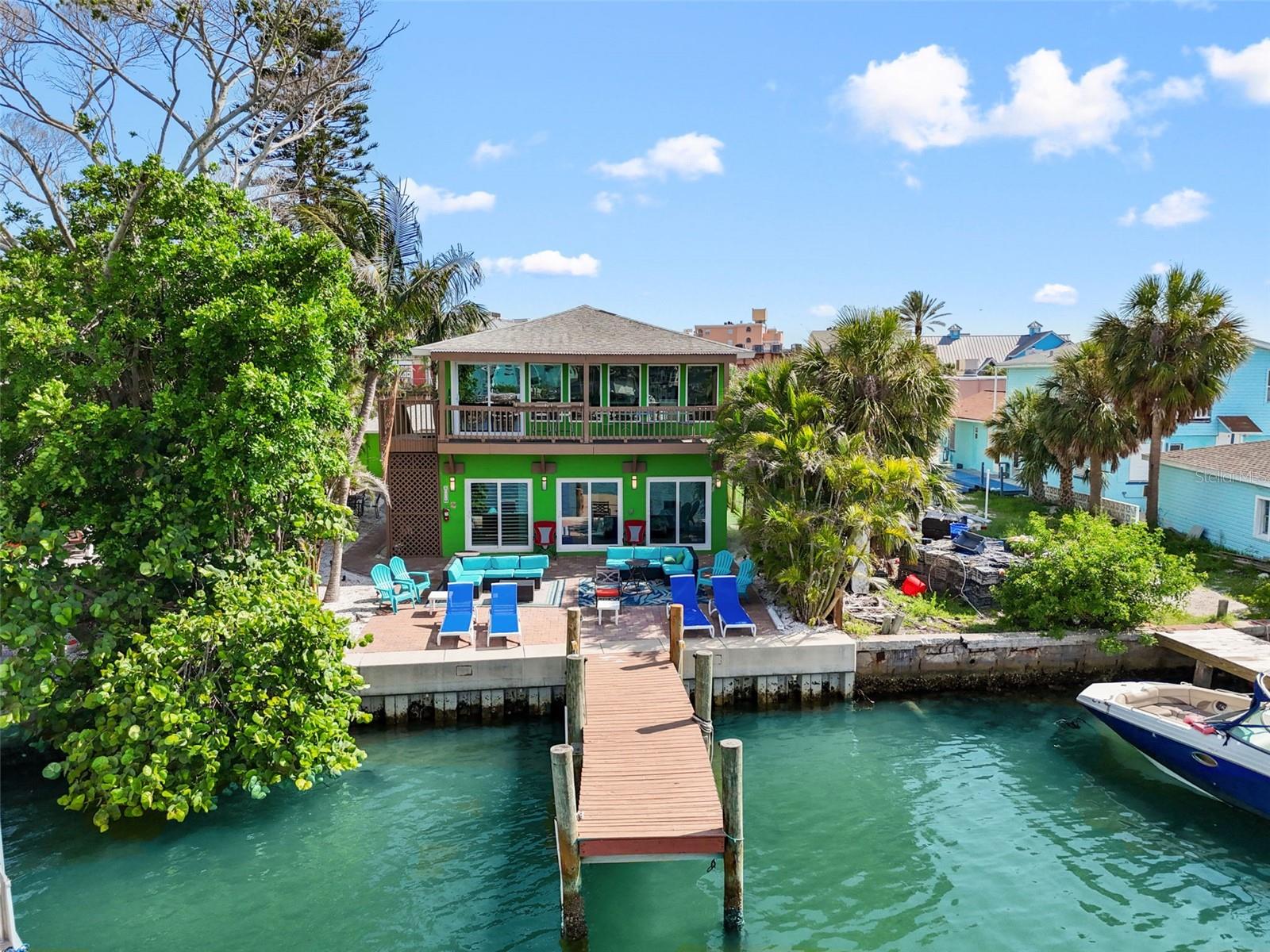 Discover a rare investment opportunity with this waterfront, 5-unit licensed hotel, just steps from the iconic John's Pass Village & Boardwalk and directly across the street from the sugar-white sands of Madeira Beach. Recently refreshed with new furniture in 2025, this turn-key property offers immediate income potential and year-round appeal for both vacationers and long-term guests.
Privately nestled in a lush, tropical setting, the property includes four 2-bedroom, 1-bath units and one spacious 3-bedroom, 2-bath unit—a rare find in this area. Each unit features an individual electric meter, fully furnished, and equipped with full kitchens for a home-away-from-home experience. Guests will appreciate designated parking spaces - seven in total for assigned and guest parking- a serene paver patios, and a private dock with electricity and water—perfect for boaters or simply enjoying sunsets on the Intracoastal Waterway.
The property is outfitted with electronic door locks, making day-to-day operations seamless and ideal for remote management or self-check-in. The three-bedroom unit adds unique flexibility—perfect for an owner-operator, seasonal resident manager, or Airbnb host running the property remotely. A separate utility room houses a washer and dryer for guest use or if self managed to wash during turn over.
Location is everything, and this property places guests within walking distance to John's Pass Village, a vibrant hub for shopping, waterfront dining, bars, live music, fishing charters, jet ski rentals, dolphin cruises, and more. With over 100 merchants, John's Pass is one of the most visited attractions on Florida’s Gulf Coast, drawing more than 2 million visitors annually. Whether your guests are beach lovers, foodies, or adventure seekers, this one-of-a-kind property is ideally situated for them to enjoy the very best of Florida's Gulf Coast.
Don’t miss this rare chance to own a fully licensed, turn-key hospitality business in one of Tampa Bay’s most desirable waterfront destinations.