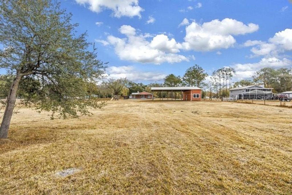 Photo of 8521 Ehren Cutoff, Land O Lakes, FL 34639 (MLS # TB8474108)