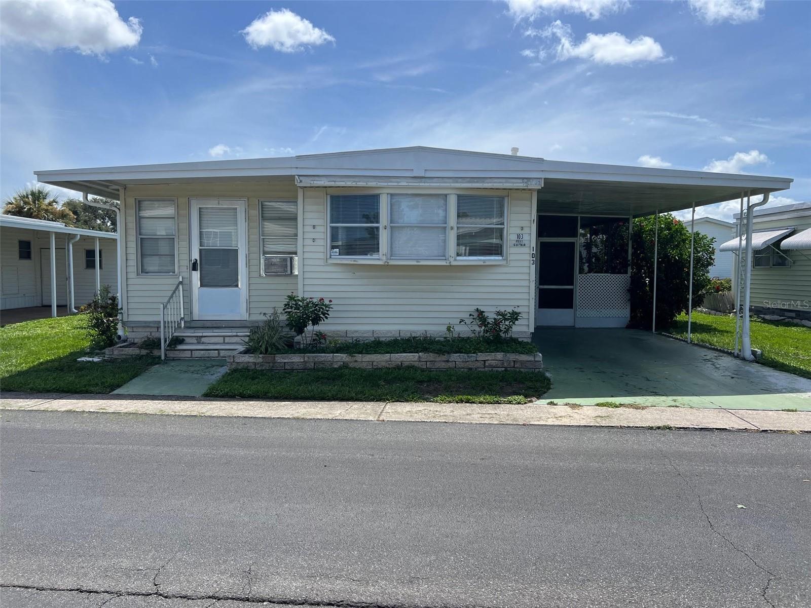 It is my pleasure to introduce you to Palm Hill Country Club, an established 55+ community that offers residents a comfortable and connected living environment. This two-bedroom, two-bathroom home provides exceptional value, with water, sewer, garbage collection, lawn care, internet, and cable included in the monthly fee of $554.00. Residents enjoy an active lifestyle with access to amenities, including swimming pools, two Jacuzzis, tennis courts, shuffleboard, billiards, pickleball, horseshoes, and clubhouses designed for socials and community events.
INTERIOR:
Enter to find generously proportioned living spaces designed for both comfortable relaxation and effortless entertainment. The generous 8x10 eat-in kitchen, complete with an opportune breakfast bar, appliances, vinyl flooring and abundant cabinetry, is perfect for casual mornings or hosting friends. A spacious, elevated Florida room—fully air-conditioned—provides an additional area ideal for gatherings or quiet evenings, effectively increasing your living space. The property also includes a 10x11 living room, central heating and air conditioning (installed in 2020), and ceiling fans throughout, ensuring comfort year-round. You'll also find updated windows, stylish vinyl plank flooring, and a sliding door with sleek built-in blinds. Two spacious bedrooms provide restful retreats for you and your guests, while the upgraded bathroom offers a new vanity, modern lighting, plentiful storage, vinyl flooring and a walk-in shower for a truly refreshed feel.
EXTERIOR:
The exterior of this residence features vinyl siding, a lowered screened room that offers additional space for visits, and a one-car carport. The roof was updated in 2016. A spacious shed is equipped to house both a washer and dryer and additionally features a complete bathroom to provide supplementary convenience for the household. The property is offered at $59,900, including a share, presenting an excellent opportunity for customization to suit individual preferences. Call today for your private showing!