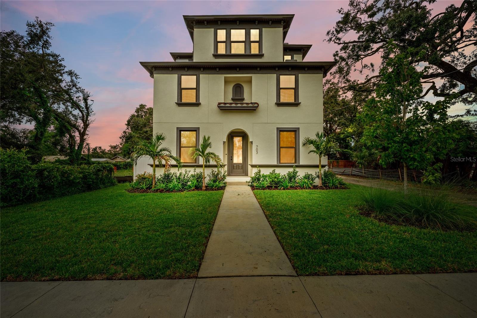 Experience Luxury Living in the heart of Tampa Heights crowned jewel, Ridgewood Park. Located in the epicenter of all things holy, you are surrounded by award-winning restaurants, shopping and cultural opportunities in this turn-key, new construction mediterranean inspired pool home. Just a few blocks from Armature Works, The Tampa Riverwalk and Downtown Tampa, you will experience the very best of urban living. Step through the front doors and you will be delighted at every corner. LVP flooring throughout, home office off of the entrance with custom framed steel french doors, color drenched in a delicious green, with custom cabinetry, lighting and shelves. Powder bath has wainscoting, pendant lighting and designer wallpaper. You will never want to leave the kitchen with leathered quartz countertops, gorgeous island, built in double oven, stove top, custom hood, pot filler, coffee/bar enclave with wine fridge and open shelving, all overlooking the living room and pool. Living room has electric fireplace wired for TV. Upstairs on 2nd floor is the Primary Bedroom with Ensuite bathroom, walk in shower, private water closet, walk in closet with ample space and double vanity. Two additional bedrooms and bathroom on 2nd floor. The 3rd floor is the star of the show with VIEWS OF DOWNTOWN TAMPA, a loft with it's own private mini bar area with built in beverage fridge, oversized 4th bedroom that overlooks the pool and shares ensuite bathroom with loft. The bathroom has designer wallpaper, large vanity with plenty of storage, walk in shower, custom shelving and quartz countertop. The home has an outdoor shower overlooking the pool and alley access to the 2 car garage. This home is a dream come true. Call to schedule private tour.