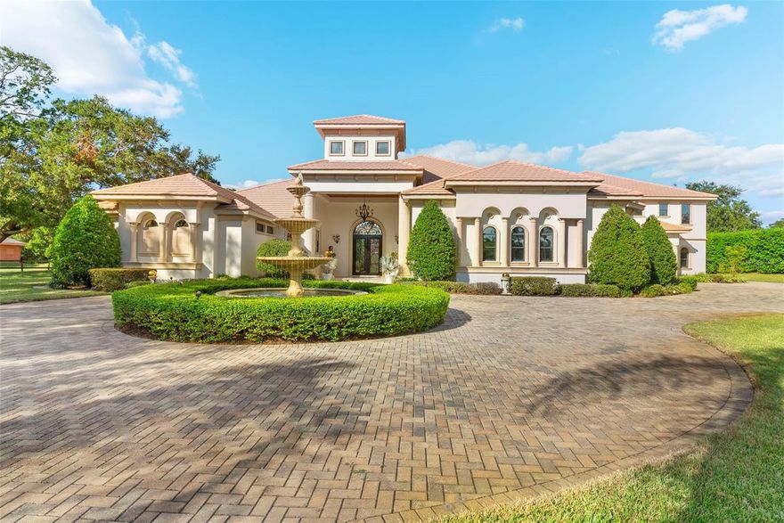 Experience Luxurious Living in the Heart of Plant City, Florida
Perfectly situated between Tampa and Lakeland, this extraordinary family estate in a non-flood zone redefines luxury living. Spanning an impressive 13,736 total square feet, this masterpiece offers five bedrooms, six full bathrooms, and two half bathrooms, including dual ground-floor owner’s suites and en-suite bathrooms for every bedroom, ensuring privacy and comfort for all.
Set on a sprawling 1.43-acre lot, the estate features nearly 9,000 heated square feet and over 2,200 square feet of covered lanai space, designed for both grand entertaining and cherished family moments.
At the heart of the home lies a chef’s kitchen that is truly a culinary dream. It boasts custom cabinetry, exotic granite countertops, a six-burner Wolfe range with griddle, double ovens, dual Thermador dishwashers, an oversized GE Monogram refrigerator and freezer, and an exquisite alabaster chandelier. Complementing the kitchen are formal living and dining rooms radiating sophistication, as well as casual family spaces and a media room complete with a wet bar.
The two opulent ground-floor owner’s suites feature spacious living areas and full dressing rooms, while upstairs, additional bedrooms with en-suite bathrooms and a bonus room provide ample space for family or guests. A detached guest suite offers a private retreat, complete with its own kitchen, living room, bedroom, and bath, plus direct outdoor access.
Outside, the estate transforms into a personal resort. A heated pool, spa, and full pool bath are paired with elegant entertaining spaces under cedar ceilings. The outdoor kitchen and fireplace create the perfect setting for gatherings, while the wireless sound system extends seamlessly from the interior to the outdoor lanai.
Additional premium features include a steel frame construction with a lifetime roof, tinted film on all windows for added privacy and energy efficiency, Imperial Italian marble, Venetian plaster, coffered ceilings, and decorative wainscoting.
Conveniently located just minutes from the charming Plant City Historic Downtown, with its local shops, dining, and the famed Winter Strawberry Festival, this estate combines timeless European elegance with modern Florida charm. This isn’t just a home; it’s a lifestyle—a perfect fusion of tradition, luxury, and leisure.
Discover your dream home today. Call to setup a private showing.