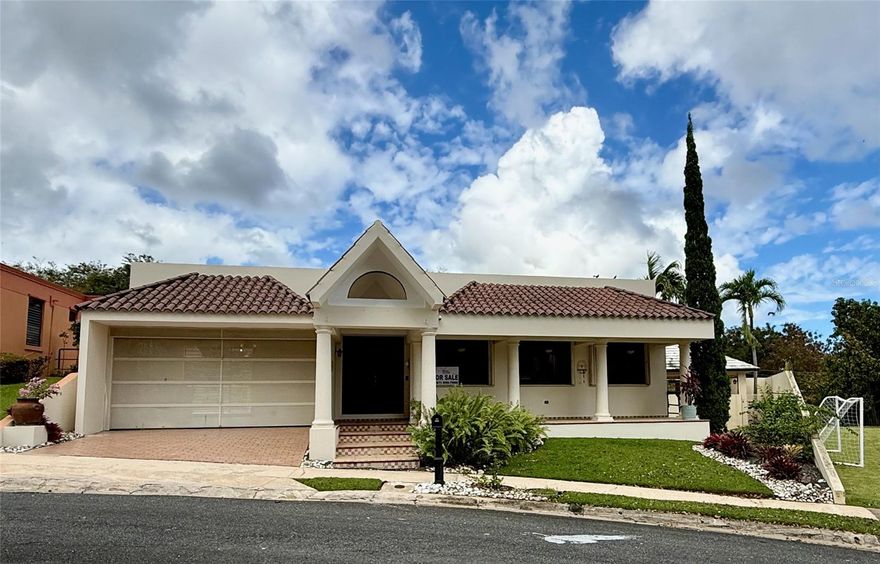 Beautiful two-level residence in Hill Mansions, San Juan, conveniently located near Hospital San Lucas and Cupeyville School, with easy access to main roads, schools, shopping, and everyday conveniences. Situated on a 799.69 sq. m. lot and offering approximately 3,000 sq. ft. of living area, this property features excellent outdoor living spaces including a swimming pool, gazebo, patio, porch, open terrace, storage areas, and spacious paved surroundings. The entry level features the main kitchen, living-dining area, one full bathroom, a two-car garage, and a private apartment within the residence with 1 bedroom, 1 bathroom, and kitchen. Recent improvements include a new pool pump (2025), new Danosa roof with 10-year warranty (2023), 600-gallon water cistern and pump (2023), all A/C units replaced in 2023, upgraded electrical lines (2023), security cameras, dishwasher, and an additional plug-in for a gas generator. The home also features 40+ solar panels and Tesla Powerwall battery backup that service the entire house. Solar system is subject to an existing 25-year Sunnova lease. Buyer must qualify to assume the solar lease. Current monthly payment is approximately $593.08 with Auto-ACH. Excellent opportunity to own a well-improved home with great outdoor amenities and energy-efficient features in a prime San Juan location.