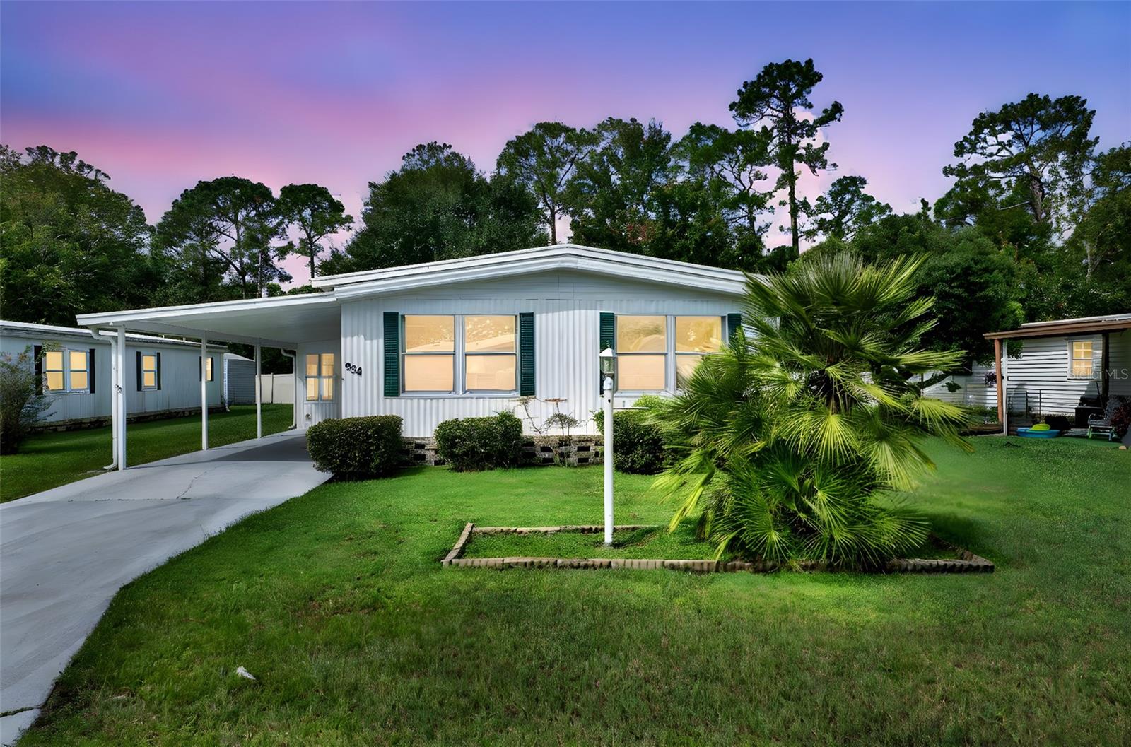 WELCOME TO THE KOVE ESTATE 55+ CO-OP Community Resort Style Living at its finest, all the thrills without all the fuss.a premier 55+ community in Osteen. There is no lot rent, as a share in the community conveys with the sale. With a monthly cooperative fee of $270 which allows you to Enjoy Year Round 9 Hole Golf Corse, 2 pools, one heated, tennis courts, pickle-ball, community events and the peaceful nights all in your very own gated community. This unit is over 1300sq ft with a large Living Room Dining Room combinations. Large Kitchen with a breakfast eat-in counter. Cozy Family room leading to the enclosed Sunroom. Large Master Bedroom leads to the Primary Bathroom with walk-in closet,Secondary Bedroom features a large walk-in closet connects to a full secondary bathroom. Indoor laundry room. Large Storage shed. Located just outside of Historical Sanford Fl. Sanford Airport is minutes away, Daytona Beach 40 minutes, Disney 45 Minutes away. The perfect spot to call home.