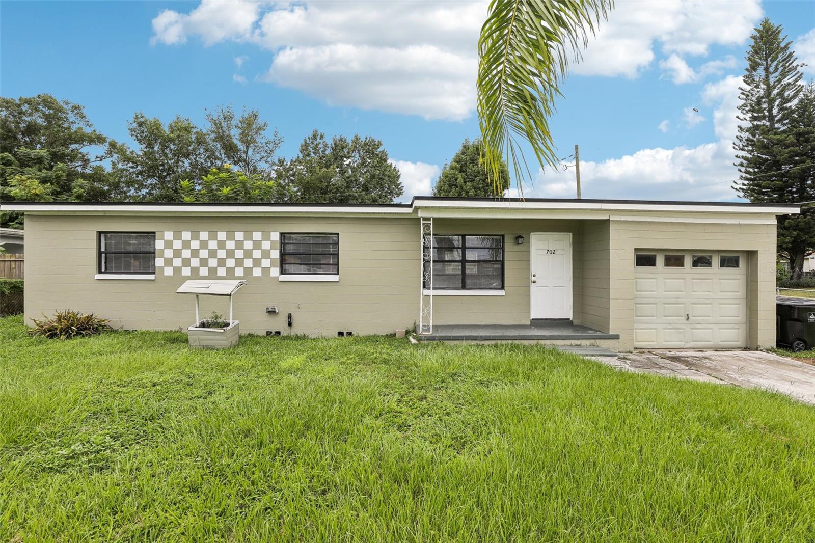 One or more photo(s) has been virtually staged. Welcome to this 3-bedroom, 2-bathroom single-family home in the heart of Orlando. With 946 square feet of living space, this home features a comfortable layout designed for everyday living. The open floor plan connects the living room, dining area, and kitchen, creating a bright and inviting space. Vinyl flooring runs throughout the home for a clean and modern look. Recent improvements include a new HVAC system (2024), a new roof (2023), brand-new exterior electrical wiring leading to the home, and a new electrical box, offering peace of mind for years to come. The spacious backyard provides plenty of room to relax, garden, or entertain outdoors. Ideally located just minutes from downtown Orlando, you’ll have easy access to major highways, shopping, dining, the Orlando International Airport, and world-class attractions like Disney. With its central location, practical updates, and functional design, this home is a great opportunity to enjoy the best of Orlando living. Mortgage savings may be available for buyers of this listing.