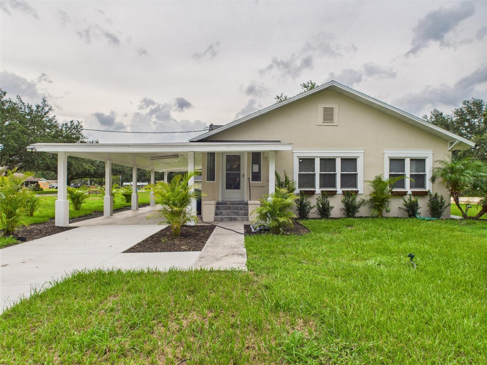0% DOWN PAYMENT ELIGIBLE! NO HOA! NEWLY RENOVATED & MOVE IN READY! Beautiful, fully remodeled 4BR 2BA home in Fort Meade, FL ready for proud new owners. BRAND NEW ROOF 2024! The home features new luxury vinyl flooring, new granite countertops throughout, updated recessed light fixtures, and fresh neutral exterior paint. Most of the windows have been replaced, providing ample natural light in the living and family room areas. New built-in closet in the fourth bedroom will be added prior to closing. Newly poured cement driveway and new landscaping. Upgraded bathrooms with new shower tile and glass sliding doors, new hardware, new double vanity and sinks and new tile flooring. The kitchen features brand-new stainless steel appliances, a spacious deep sink, and a secondary prep area complete with additional cabinetry, countertops, and a sink, perfect for extended cooking or entertaining needs. Plenty of parking and storage space with an attached two-car carport and is situated on 0.27 acres of OWNED LAND that can be subdivided or used for anything desired. Located in a peaceful, quiet neighborhood near Fort Meade historical museum, grocery stores, restaurants, parks, and other services. Perfect for a large family, multi-generational living, or rental income potential. The expansive yard gives you all the space you need to bring your toys, vehicles, RVs, or boats. Whether you're looking for a personal residence or a savvy investment, this move-in-ready gem delivers comfort, space, and freedom. This property is serviced by city water and sewer, eliminating the need for well water or septic tank servicing, and providing added convenience and reliability. NO FLOOD ZONE! Seller and private financing available. 0% DOWN PAYMENT FINANCING OPTION AVAILABLE. Do NOT wait, it will not last long!