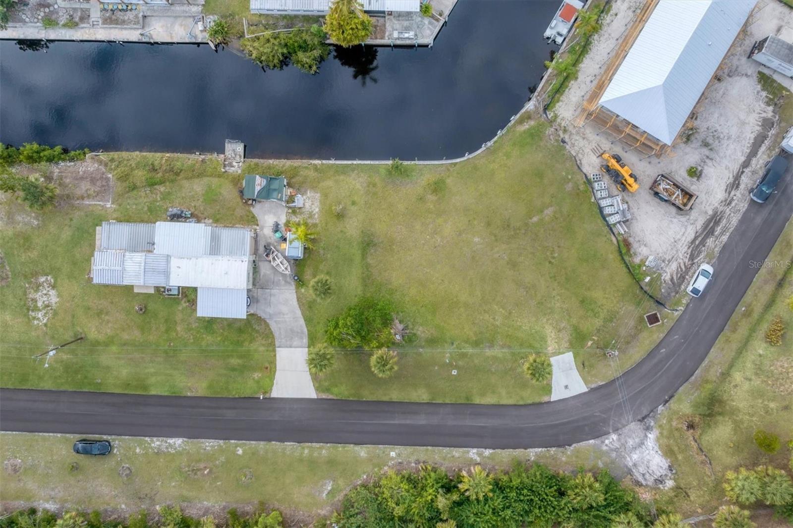 Sailboat waterway and right around the corner from open water! Discover the possibilities that you can have with no bridges to contend with and the unimaginable open waters to paradise. Sunshine and sandy beaches await! With 99' of seawall you are able to dock your boat or add a lift. Currently there is water at the property. With views overlooking 2 canals this property has multiple options for a nice house layout. Centrally located between Port Charlotte, North Port and Englewood giving you so many options for Restaurants, Bars, Shops, Beaches, Golf Courses, Medical Facilities and more.