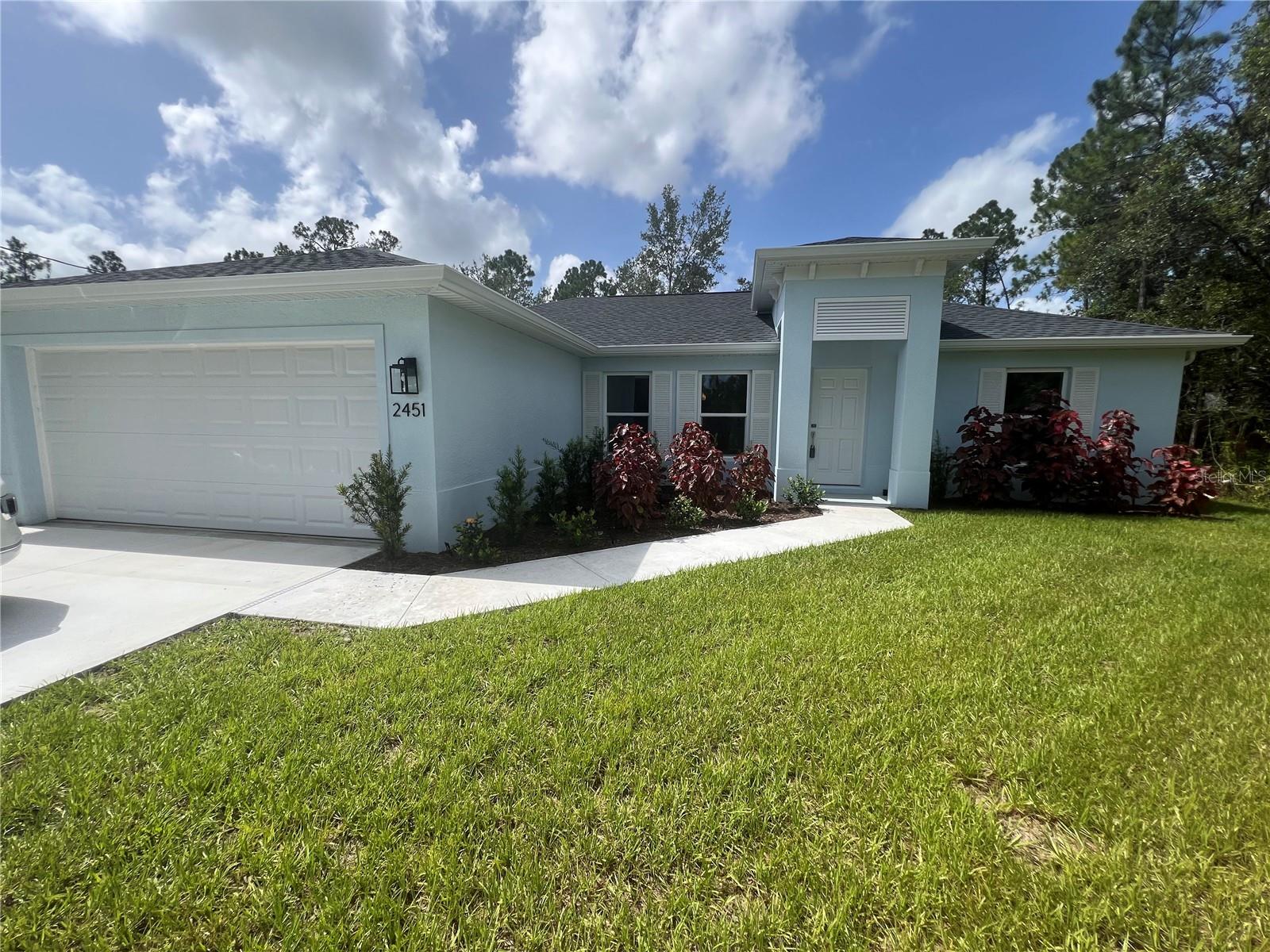 One or more photo(s) has been virtually staged. **ANNUAL**BEAUTIFUL 3/2/2 NEW CONSTRUCTION HOME AVAILABLE NOW**COMING SOON NEW VINYL FENCE** Home has an open, split floor plan with vaulted ceilings, porcelain tile throughout, and sliding glass doors leading to large screened lanai. Gorgeous kitchen with full overlay cabinets, stone countertops, stainless steel appliances, and breakfast bar. Large primary bedroom has walk-in closet and ensuite with dual vanities. Indoor laundry room has cabinets for extra storage and utility sink. Home also has hurricane impact windows, ceiling fans, and sprinkler system. Conveniently located to shopping and restaurants. Call for showing today!!