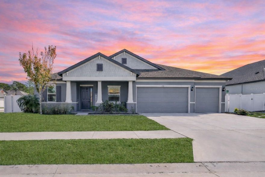 STUNNING 2023 WILLIAM RYAN CRAFTSMAN | 5 BED + HUGE FLEX ROOM (POSSIBLE 6TH) | 4 BATH | 3-CAR | IMPACT WINDOWS | ENERGY EFFICIENT Welcome home to this beautiful 2023 William Ryan Craftsman Joyce Model in the boutique community of Whiting Estates, featuring a low HOA of 95/month and a location that makes commuting a breeze with quick access to the Suncoast Parkway for Tampa and surrounding areas. From the moment you arrive, you'll love the welcoming curb appeal, corner-lot setting, sidewalk-lined streets, and the classic charm of a front porch—plus a back porch overlooking a large backyard with vinyl fencing, perfect for play, pets, entertaining, or simply relaxing. Inside, this home was designed for comfort and ''room to grow'' with 10-foot ceilings, 8-foot interior doors, and impact windows throughout. The layout offers five generously sized bedrooms, four full bathrooms, and an incredible upstairs flex room (approx. 675 sq ft) with a closet—ideal as a media room, game room, home office, or optional 6th bedroom. The heart of the home is the gourmet kitchen, showcasing white shaker cabinetry with crown molding, soft-close features, a gray shaker island, under-cabinet lighting, quartz countertops, and a timeless beveled subway tile backsplash. Enjoy high-end stainless appliances including a double oven (with convection and microwave capability), cooktop, chimney-style vent hood, double-drawer refrigerator, a large pantry, and an undermounted single-bowl stainless sink—a true chef's dream. The primary suite is a private retreat, spacious enough to accommodate a sitting area, and features a beautiful bay window that fills the room with natural light. The spa-like primary bath offers a soaking tub, walk-in shower, dual square undermounted sinks, shaker cabinetry, and quartz countertops, plus a huge walk-in closet. Added feature: this home is energy efficient with foam-injected block walls, plus it's already prepped for future upgrades with 80-amp pool pre-wire and laundry tub pre-plumbing. You'll also appreciate the peace of mind of a transferable structural warranty. Located in the highly desired Nature Coast school zone, and just minutes from local favorites like Anderson Snow Sports Complex and the Suncoast Bike Trail, this home truly checks every box. Move-in ready, beautifully upgraded, and absolutely stunning—schedule your private showing today!