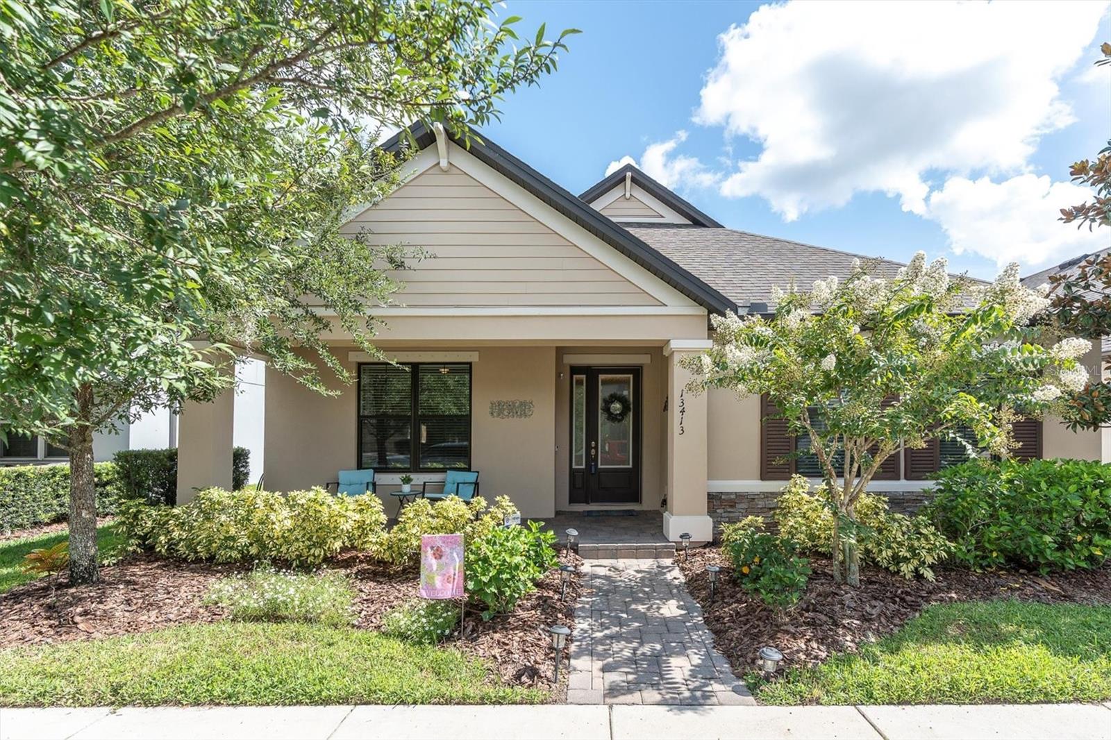 Located in the #1 community in the Tampa Bay area, this beautifully maintained 3-bedroom, 2.5-bath home with a versatile bonus room—currently used as a movie room—offers a perfect blend of style, comfort, and functionality. The bonus/movie/office room features barn doors for added privacy. At the same time, the open-concept living area includes an electric fireplace and recessed lighting that doubles as built-in speakers with dimmable settings. The chef’s kitchen features an oversized island, pull-out trash, under-cabinet lighting, breakfast bar, pendant lighting, and a large buffet with matching granite—ideal for entertaining. The primary suite includes a walk-in closet with custom shelving, and the home is equipped with a tankless water heater, hurricane shutters, a Wyze camera security system, and a laundry room complete with a utility sink. Enjoy outdoor living with a covered front porch, a screened-in back lanai with privacy curtains, a two-years-new hot tub in like-new condition, and a built-in gas grill that stays with the home. Upgrade 12' sliders to the lanai. The backyard is fully fenced with elegant wrought iron fencing, perfect for both privacy and pets. Thoughtful upgrades and modern finishes throughout make this home an exceptional opportunity in a highly sought-after location. Epoxy garage flooring. The Paver driveway adds a touch of class. Batten Lane is only 9/10th of a mile from the neighborhood preschool and the A-rated Starkey K-8 Magnet School that specializes in Computer Science, Fine Arts & World Language, complete with its golf cart parking lot. Starkey Ranch offers 20 miles of hiking/biking trails through the preserve, tennis courts, a public library, a basketball court, a track, 2 pools, dog parks, playgrounds, a district park with baseball, soccer, football, and lacrosse fields, and so much more! Close to grocery, medical, restaurants, and entertainment. Easy access to the Veterans Expressway for travel to downtown Tampa/Tampa International Airport. Minutes to award-winning beaches. This home has been meticulously maintained and is TRULY turn-key ready!