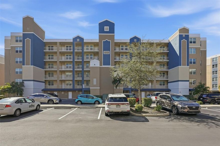 One or more photo(s) has been virtually staged. Discover this highly sought-after, end unit 3-bedroom, 2-bathroom condo, offering exceptional building security via an elevator code and locked ground floor doors.  The home is packed with over-the-top upgrades for modern living, including a Schlage smart lock, Ring doorbell, and Simply Safe Alarm System. The heart of the home is an exquisite eat-in kitchen featuring a stylish backsplash, stainless steel appliances (with an oven and cooktop that have never been used), push button garbage disposal, custom wide shelving in pantry and convenient pop-up electric outlets. Quartz countertops, brushed nickel hardware and soft-close cabinets/drawers found throughout. Enjoy peace of mind with a dedicated valuables closet featuring an enhanced security lock.  The air handler is easily accessible in the living room closet (with slatted doors), making filter changes and maintenance simple. Spacious living room/dining area with designer track & recessed lighting plus NEST thermostat. The Primary Suite provides a private retreat with an elegant bath featuring an expansive frameless shower with custom shower head plus a separate private toilet. The hall bath includes a shower with a tub and custom showerhead. All rooms feature ceiling fans and boast high-end luxury vinyl planks throughout, beautiful upgraded solid wood window treatments ($10k value), extra electrical outlets & closets galore. The oversized laundry room comes equipped with an LG Washer & Dryer (convey), electric water heater with a timer, shelving, and an overflow valve added to the utility sink with a beautiful backsplash. Enjoy the outdoors mosquito free on the enclosed lanai with a showcase concrete coating and Rod Runner shades or step out onto the rare additional open balcony to get some fresh air and an unparalleled view of the gorgeous lake fountain. Benefit from a prized end garage (G1) with HOA-included electric and community allowance for freezers, refrigerators and dehumidifiers. The community is well-maintained with the building repainted in 2024, new pavement in progress for 2025 and onsite property manager. Ideally located close to Winn Dixie, Sprouts, Walgreens, Acropol and numerous other restaurants.