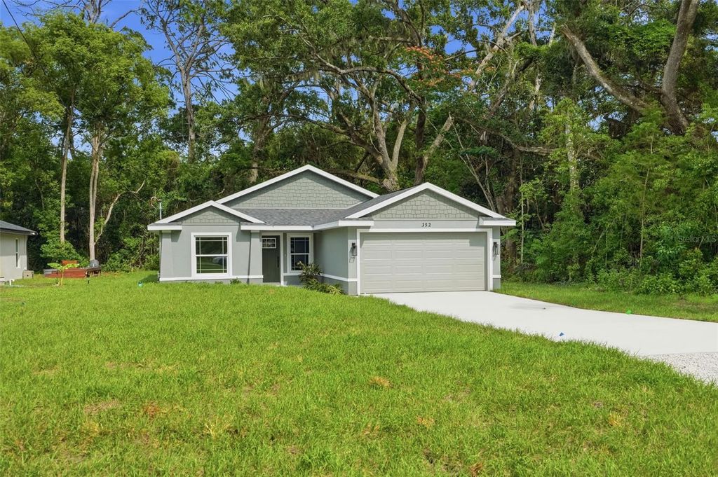 Photo of 352 Garfield Ave, Masaryktown, FL 34604 (MLS # W7886450)