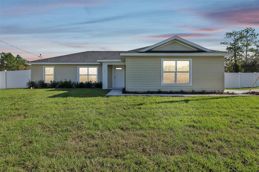 Exceptional Hemlock II Model on a premium corner lot and FULLY FENCED! Seller is offering $5,000 towards your closing costs!
Welcome to this contemporary residence that blends modern style with comfortable, turnkey living.
Situated on a spacious corner lot, this home makes a striking first impression with its low-maintenance yet durable Hardie Board siding and an attractive side-load garage. The property is fully secured by a 6-foot vinyl privacy fence, creating a perfect private outdoor sanctuary.
Step inside to an atmosphere of spaciousness and effortless flow, defined by high ceilings, an open-concept layout, and a thoughtfully designed split-floor plan. Durable and stylish luxury vinyl plank flooring spans every room, offering both beauty and easy maintenance.
The kitchen includes soft-close cabinetry, granite countertops, and a suite of sleek stainless steel appliances. A generous kitchen island serves perfectly as a casual dining area, breakfast bar, or prep space, all illuminated by recessed lighting. These high-quality features are echoed in the bathrooms, which also feature granite countertops.
The private owner's retreat is elevated by an elegant tray ceiling and includes a large walk-in closet. Its en-suite bathroom is a luxurious space featuring dual sinks and a walk-in shower accented with beautiful floor-to-ceiling wall tile.
An additional highlight is the screened covered lanai, providing a wonderful spot to enjoy the outdoors shielded from the elements. The home is truly turnkey, complete with ceiling fans, blinds, and a garage door opener. An indoor laundry room adds further convenience.
Don't miss the opportunity to own this highly upgraded home on a premium lot. Schedule your showing today!