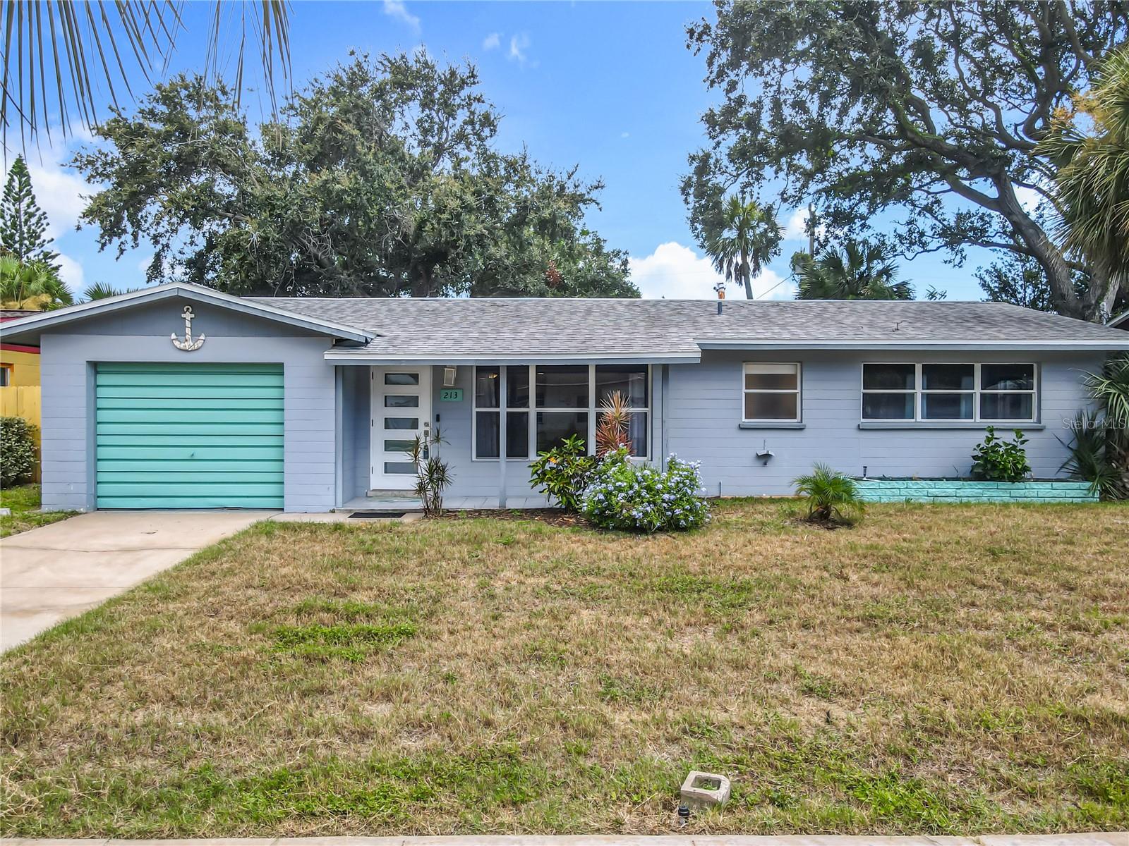Coastal Living at Its Best - Just Steps from the Soft Sand and Pristine Beaches of Ormond by the Sea! This is your opportunity for an affordable slice of paradise— a charming 2-bed, 2-bath beachside home that perfectly blends comfort, durability, and location. Nestled on a peaceful, no-driving beach, this uncrowded stretch of coastline is where neighbors wave, sunrises are sacred, and salt air is basically free therapy. Enjoy morning strolls, shell hunting, or coffee with the sunrise, the beach short distance from your front door. Inside, you'll find a bright, open layout with terrazzo floors, block construction, and peace of mind in the X flood zone. Major updates include a 2020 roof and A/C in 2020, making this home as solid as it is stylish. The updated kitchen features modern butcher block countertops and a center island—perfect for meal prep and casual entertaining. The living and dining areas flow together, ideal for relaxed coastal living. Step out back to your screened porch and spacious fenced-in yard, surrounded by mature tropical landscaping a private retreat with endless potential for gardening, pets, a future pool, or simply soaking in the sea breeze. Whether you're searching for a full-time residence, vacation getaway, or smart investment, this home checks all the boxes.