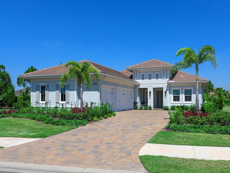 Why wait to build when this luxurious home could be yours right now?  Recently built in 2024, this Mayfield III home has the upscale finishes with a functional and desirable floor plan that you’re looking for.  With almost 3,100 SF of space, this entertaining layout is ideal for every lifestyle.  Perfectly situated on an expansive corner lot, this is your own private garden oasis.  From the great room or the back lanai you can enjoy long angled, serene water views.  The long foyer elegantly leads you to the great room with tray ceiling and verdant garden views where you will see the fine finishes that present throughout the home include large-format polished porcelain tile flooring, custom ceilings, and walls of cabinetry in the kitchen for maximum storage.  Pocketing sliding glass doors seamlessly blend the outdoor and indoor entertaining spaces.  On the paver lanai you have a spacious gathering area that is pre-plumbed for a future fireplace, plus an outdoor kitchen for meals alfresco.  The sparkling, heated pool and spa are perfectly poised to take advantage of the side lake views and are surrounded by new lush landscaping to create your own private escape.  Completing the perfect outdoor space is a convenient outdoor accessible pool bathroom.  Inside the chef’s kitchen highlights modern living with a central island, luminous quartzite counters and full height backsplash, integrated cabinetry pantry, storage on the back side of the island, KitchenAid stainless steel appliance suite, and casual dinette.  If you’re looking for the ideal location for holiday meals, the formal dining room is the perfect place; currently used as a music room, this space is also flexible as a formal living room, second den, media room, or anything else your lifestyle desires.  The study showcases double doors for privacy, plus a walk-in closet for extra storage or dual function as a 5th bedroom.  The primary suite is a serene escape with French doors to the lanai, dual oversized walk-in closets, and en-suite bathroom with split vanities, freestanding tub, and walk-in shower.  Guests will embrace comfort in three true guest bedrooms; the first guest bedroom has an adjacent full bathroom all to itself, while the second and third guest bedrooms share an en-suite jack and jill bathroom.  The laundry room serves dual purpose as a mudroom with direct access to the side loading 3-car garage, plus there is an indoor powder bathroom for guests.  The spacious 3-car garage even has its own insulation in the walls and ceiling for a cooler climate.  Peace of mind is secured with impact windows and doors throughout.  The Lake Club is an exclusive premier, gated community with a Grande Clubhouse, restaurant, pool, tennis, pickleball and more.  Lakewood Ranch is the top multi-generational community in the country for 8 years in a row with award-winning shopping, dining, A-rated schools, parks, and nearby beaches.