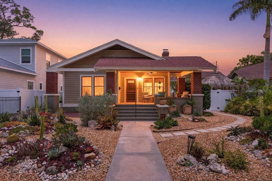 Once upon a time in 1926, something beautiful was built and it still shines like a newly minted penny!  Welcome to a thoughtfully restored bungalow in the heart of Historic Kenwood.
Step onto the deep front porch — original tile intact — and you’ll immediately understand what makes this Saint Petersburg gem special. This lovingly maintained home blends classic character with serious, top-to-bottom investment, offering the next owner true peace of mind from day one.
Inside, an abundance of original doors and multiple room entrances create a naturally flexible floor plan, perfect for hosting guests, working from home, or simply giving everyone their own space under one roof. Refinished original hardwood floors flow throughout the home, complemented by a fully remodeled kitchen featuring custom inset cabinetry, soapstone countertops, Fireclay wall tile, and new hardwood floors — a seamless nod to the home’s character while delivering modern functionality. All appliances convey, including the washer and dryer in the mudroom.
Both bathrooms have been beautifully renovated, with careful attention paid to honoring original details: Heritage Tile subway ceramics, re-silvered original mirrors, and original porcelain floor tile are preserved alongside new tubs, fixtures and lighting.
The owners have invested heavily where it matters most. The foundation has been fully addressed with crawlspace encapsulation, a dehumidifier, Intellijack supports, and sistered joists — all carrying transferable warranties of up to 25 years. The garage slab has been stabilized and leveled with a transferable warranty as well. Wind mitigation as well in hand with Ultratek hurricane shutters for original windows, impact doors at all three entries, and third-nail roof reinforcement. The termite tenting comes with a transferable warranty through May 2027.
Additional highlights include a whole-house water filtration and scale prevention system, a xeriscape landscape design with a private irrigation well, custom screens for original windows, and 16 refurbished original interior doors with hardware.
Longer-standing improvements include architectural shingle roofing, PVC plumbing, and an upgraded water service line — giving you a home that’s been continuously and carefully stewarded over many years.
This is a rare opportunity to own a characterful Saint Petersburg bungalow where the charm is original and the worrying is done.