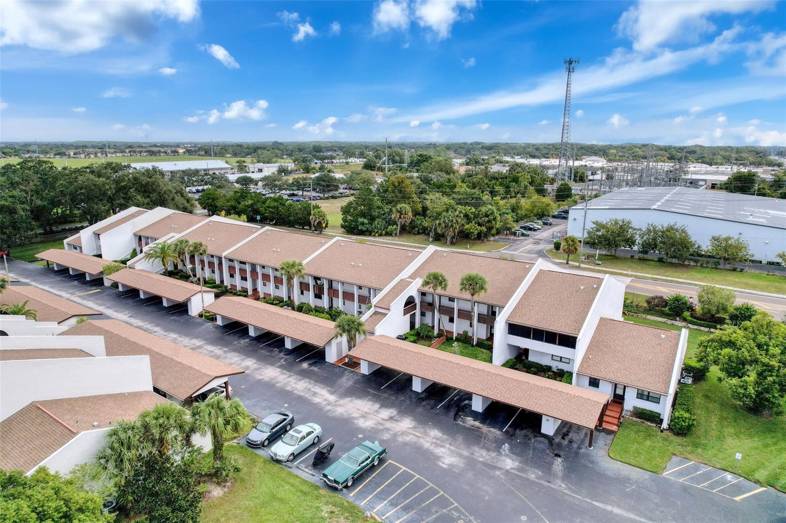 Discover elegant Florida living in this beautifully maintained first-floor condo in The Orchards of Radcliffe. This spacious 2-bedroom, 2-bath residence features a bright open layout with tasteful updates, modern laminate flooring, and an inviting enclosed lanai with hurricane-rated windows for year-round comfort and peace of mind. The gated 55+ community offers resort-style amenities including a sparkling pool, clubhouse, and beautifully landscaped grounds. The low HOA fee of $520 per month covers exterior maintenance, landscaping, access to all amenities and so much more! Combining comfort, convenience, and timeless appeal, this home delivers a refined, low-maintenance lifestyle in one of Port Richey’s most desirable communities. Two pets up to 40 pounds, are welcome.