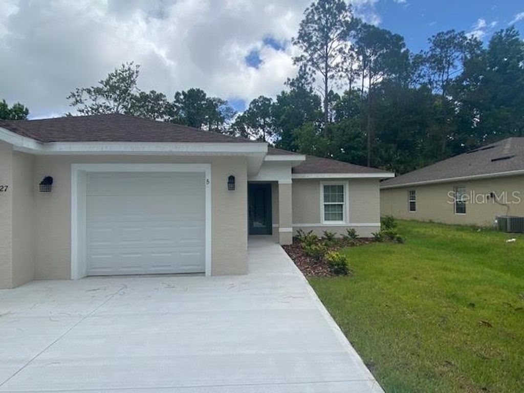 Photo of 27 Pony Lane #B, Palm Coast, FL 32164 (MLS # FC316047)