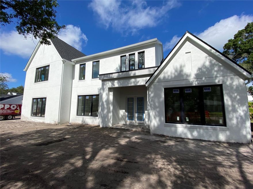 Under Construction. Highly sought after Golf View Estates NEW CONSTRUCTION single family residence by TB Homes. Anticipated completion August 2023. 5 bedrooms, 5 full bathrooms, 2 powder bathrooms and a 3 car garage situated on a generous 100' x 127' lot. The home welcomes with a 22' high soaring foyer with views straight through to the rear exterior living. The home was curated for function + beauty with a mix of wood tones to add in warmth. The study is elevated with a cathedral ceiling and exposed beams. Tray ceilings with wood inlays in foyer, dining, upper loft and primary suite. Great room with exposed beams and a mix of shiplap & calacatta marble enhances the fireplace feature wall. Truly a Chef's delight with double islands, Sub-Zero Wolf appliances and a fully equipped Scullery & separate Butler's Pantry. Entertaining spaces for all ages, with a 1st floor game room off of the rear lanai as well as a 2nd floor media room equipped with a kitchenette and powder bathroom. Additional mentions; 1st floor guest suite, wine display in dining room, wellness room with rubber mat flooring, mud-room with laundry hookups, 2nd floor laundry room and future elevator shaft. To name a few features; Level 4 drywall, 7.5" white oak flooring, crystal door knobs, Restoration Hardware lighting, smart home pre-wires ECT. Expansive silver travertine clad lanai with outdoor kitchen and pool toy storage closet. Saltwater heated pool with sunshelf & 14' spa + a large amount of green space. Under 15 minutes to Tampa International Airport, Under 10 minutes to Hyde Park Village & Downtown Tampa and Under 5 minutes to Palma Ceia Golf & Country Club. A-Rated school district. Renderings are for artistic purposes only. All information included herein should not be relied upon for accuracy. Please request a copy of the look book, spec sheet and your own private tour.