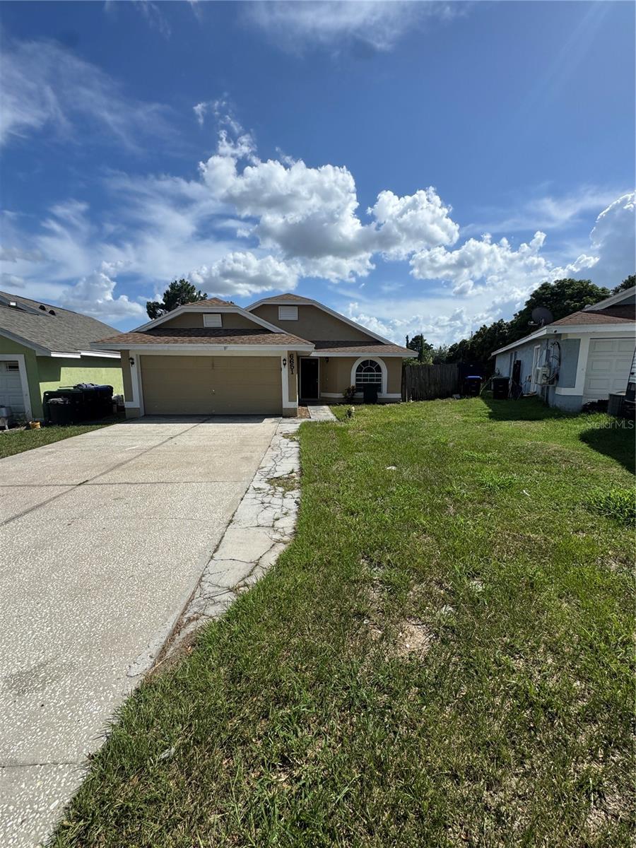 Come check out this beautiful 3/2/2 in Hiawassee Point on over a 1/4 of an acre! Seller in process of replacing roof for next owner, water heater replaced 2024, and AC replaced in 2019 so most big ticket items taken care of!! Freshly painted interior with a mixture of tile in the main living areas and new LVP flooring in the bedrooms for easy upkeep. Brand new kitchen cabinets, granite countertops, and stainless steel appliances with a large breakfast bar overlooking the dining room perfect for entertaining! Relax on the over-sized rear porch overlooking the spacious yard which includes a mature avocado tree bursting with fruit! 2 car garage with more than ample parking in driveway. Convenient to plenty of shopping and food destinations!