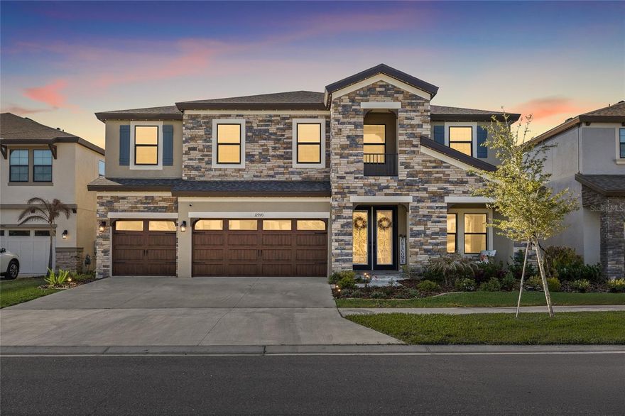 Priced to sell at $720,000, this stunning 5/4 home in the highly sought-after Hawkstone community offers 3,606 sq ft of beautifully designed living space and access to A+ rated schools. Built in 2023, this home delivers modern construction, thoughtful upgrades, and exceptional value.
The open concept layout features a designer kitchen with white cabinetry, quartz countertops, a large center island, and stylish pendant lighting, flowing seamlessly into the spacious living area highlighted by a custom stone accent wall. This versatile floor plan includes a first-floor guest suite, generously sized secondary bedrooms with walk-in closets, a large upstairs bonus room, and a luxurious owner's suite with an oversized walk-in closet and spa-like bath.
Enjoy Florida living year-round with a screened in lanai and an extended paver patio featuring a custom fire pit.
Additional features include a 3-car garage, modern finishes throughout, and a whole home water softener and filtration system for enhanced water quality. Residents enjoy access to resort-style community amenities and amenities and a convenient location near US-301 and I-75