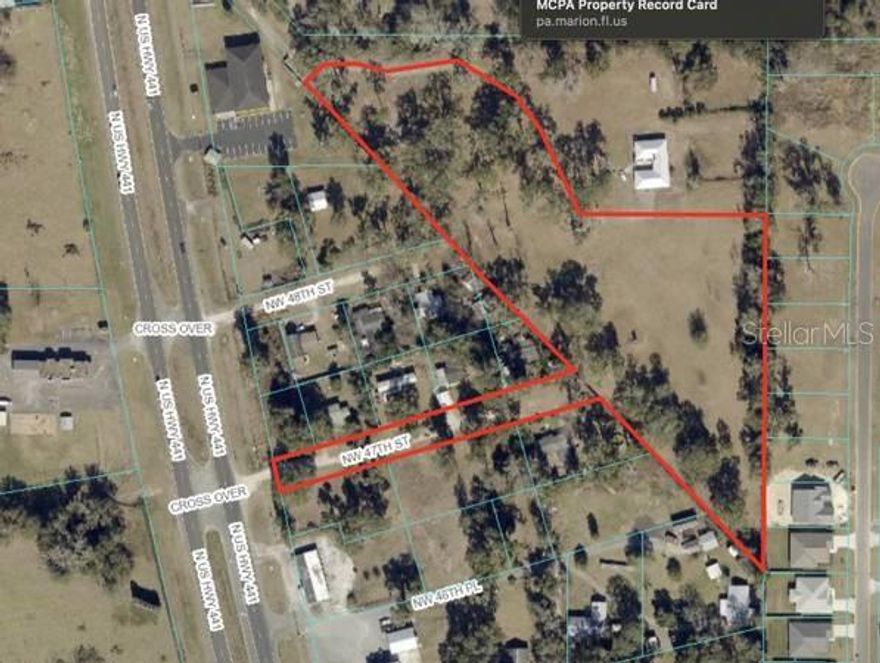 5.3 Acres HIGH and DRY Commercial Land in Ocala Central Florida, Cleared Land, graded and fenced with direct frontage on highway 441, only few minutes from the biggest State Highway 75. The Land is about 5-8 feet higher than the higher sections of the adjacent housing subdivision, and much more than the middle or lower sections of that subdivision.
This property is zoned B4, Perfect for any Business: retail, wholesale, distribution, assembly and light manufacturing, storage, cold storage, food distribution, auto care, pet hospital, auction, trailer and Mobil home assembly and sales, online sales and distribution, or just about any type of business which require B1, B2, B3, or B4 zoning. Perfect location in one of the fastest growing markets, with access to several additional markets in adjacent areas. The 5.3 acres allows for "care-taker home, it can be any size, mfg home, modular home, made from steel, block, wood construction, or can be part of the commercial building.
There are three entrances: Both the strips reaching out to 441 highway, you can put signs, and use for any commercial marketing we want along the entire strips of about 250 to 300 feet long by 55 feet wide. 
Adjacent commercial properties are valued up to $1 million an acre, this property is worth millions, priced for a quick cash sale, short term seller financing available, Amazon and Auto Zone Florida distribution center near by.

There is 3.5 acres with a home adjacent to the 5.3 acres, the owner is also considering to sell 3.5 acres, but only combine to sell with this parcel, call the listing agent today and get more information.