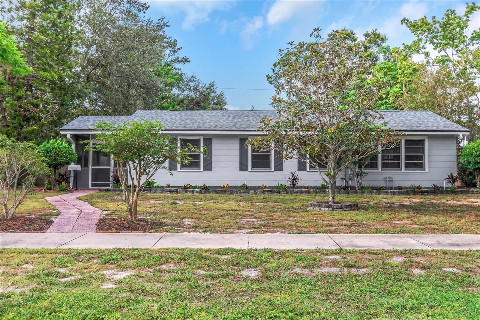 Tucked away in a quiet West St. Petersburg neighborhood near the Tyrone shopping district, St. Petersburg College, and just a short drive to the Gulf beaches, this fully renovated three-bedroom, two-bath home is move-in ready. Freshly painted inside and out, the home features a spacious living and dining room combination, new luxury vinyl plank flooring throughout, and stylish new light fixtures. The brand-new kitchen shines with granite countertops and stainless steel appliances, while both bathrooms have been beautifully updated for a modern feel.
The primary suite offers an en suite bath and walk-in closet, while a wood lined bonus room off the kitchen provides flexible space for a home office, family room, or formal dining area. A large laundry room with a double utility sink and washer/dryer hookups adds convenience. Outside, you’ll find new front landscaping with irrigation and a Rainbird timer, plus a generous backyard with alley access, two storage sheds, and plenty of space to create your own outdoor retreat.
Major updates include a new roof, new electric panel, new ductwork, and full re-piping — giving you peace of mind for years to come. This beautifully updated ranch home is move-in ready and waiting to welcome its next owner.
All room measurements are approximate and should be verified by Buyer.