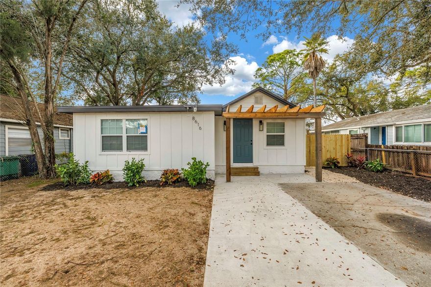A beautifully renovated Tampa gem offering modern finishes and rustic charm.  This charming 3-bedroom, 2 bath home has been thoughtfully updated from top to bottom. Step inside through a tiled foyer with a wood accent ceiling, leading you to a bright, open living area featuring luxury vinyl flooring that flows seamlessly into the kitchen. The kitchen showcases quartz countertops, stainless steel appliances, and ample cabinetry.  Each bedroom is generously sized, offering plenty of storage and functionality. Both bathrooms have been modernized with sleek fixtures and finishes, adding a stylish touch to the home’s thoughtful design. There is a large front yard and fully fenced backyard ready for you to customize into your  own personal oasis-- perfect for gatherings, pets and outdoor enjoyment. Outdoor area includes a covered patio perfect for entertaining. Located in an established Tampa neighborhood with convenient access to DOWNTOWN Tampa, USF, Busch Gardens, hospitals, shopping, dining, and major highways. This charming property is a must see!