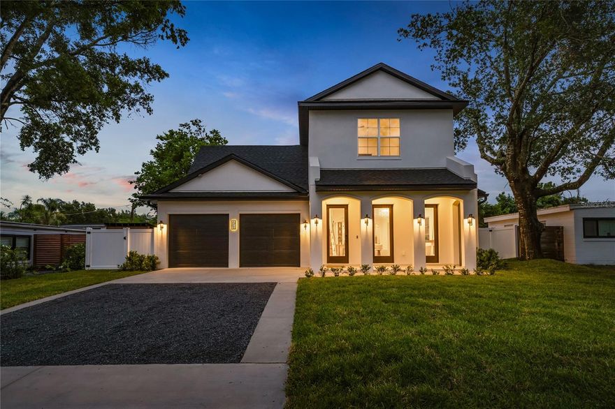 Positioned as one of the best values currently available in Winter Park, this exceptional residence designed by renowned architect Gary Hancock is a masterclass in craftsmanship, architecture, and timeless elegance. From the moment you arrive, the home commands attention with a breathtaking facade defined by graceful archways and refined architectural symmetry. Every exterior line and material selection has been intentionally chosen to create a presence that feels both bold and enduring, setting this residence apart as something truly exceptional. Inside, the home unfolds into a light-filled interior where design and livability coexist seamlessly. Ten-foot ceilings, level 5 drywall, and an abundance of expansive windows allow natural light to pour into every space, illuminating the impeccable finishes and creating an airy, sophisticated atmosphere throughout. Upgraded designer light fixtures add warmth and character, while the open-concept layout is anchored by a stunning living area centered around a refined fireplace, offering a natural gathering space that feels both intimate and grand. Flowing effortlessly from the living room, the dining area opens through elegant doors to the outdoor entertaining spaces, beautifully blending indoor and outdoor living. At the heart of the home, the chefs kitchen is as visually striking as it is thoughtfully designed. Custom cabinetry, sleek quartz countertops, a paneled refrigerator, and a premium induction range, reflect the builders uncompromising commitment to quality, performance, and clean modern design. The primary suite is a private retreat, highlighted by a spa-inspired bath with a freestanding soaking tub, an expansive walk-in shower, and a beautifully designed walk-in closet with direct access to the laundry room for effortless everyday living. Each secondary bedroom continues the theme of elevated design, offering generous proportions, abundant natural light, and elegantly appointed en-suite baths that ensure comfort and privacy for family and guests alike. Outdoors, the home reveals another level of thoughtful craftsmanship. A covered patio with a fully equipped summer kitchen overlooks a sparkling pool and expansive backyard, creating a setting equally suited for quiet evenings or lively gatherings. What truly defines this residence is the extraordinary level of craftsmanship throughout. No detail has been overlooked, no finish treated as an afterthought, and no design decision made without intention. This is a home that feels as impressive in its execution as it does in its presence.